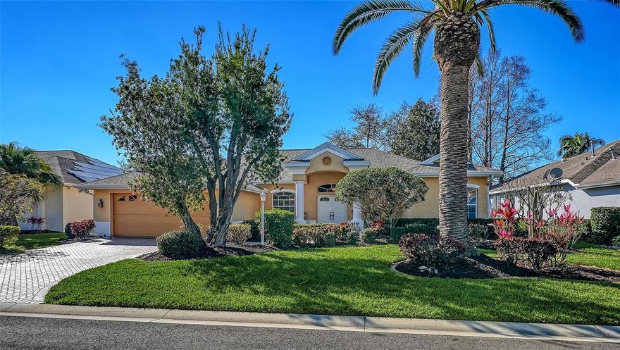 Welcome to 5566 Magnolia Tree Terrace, nestled in the charming community of Magnolia Pond in Sarasota — a quiet enclave of just 59 homes surrounded by three picturesque lakes.
A brick paver driveway leads to the two-car garage and elegant double-door entry, framed by lush, manicured landscaping. Step inside and be immediately captivated by tranquil water views and an immensely functional floor plan designed for both entertaining and everyday living. The formal living room showcases a vaulted ceiling and pocketing sliders that seamlessly blend indoor and outdoor spaces, opening to the pool and tropical vista beyond. A separate formal dining room with wood flooring and built-in server creates the perfect setting for memorable gatherings.
The open kitchen flows effortlessly into the casual dining area and family room, while sliding glass doors lead to the screened lanai — ideal for hosting or simply relaxing. Outside, enjoy a gas-heated pool and spa, brick paver deck, and a separate covered area perfect for a future outdoor kitchen.  
This four-bedroom home features a desirable split floor plan. The spacious primary suite boasts tray ceilings, a walk-in closet, and private lanai access, and update en-suite bathroom.  A second bedroom includes an bath with direct pool access for guest privacy. Two additional bedrooms share the 3rd bathroom, providing comfort and flexibility for family or visitors. Crown molding, architectural ledges, and thoughtful details enhance the home throughout. A new roof in 2024 offers added peace of mind, along with the new pool cage in 2025.
Whether you're a snowbird seeking sunshine or a family wanting proximity to A-rated schools, this home delivers the Florida lifestyle at its finest. Located just minutes from the soft sands of Siesta Key Beach, world-class dining, The Mall at University Town Center, and the scenic Legacy Trail, convenience and recreation are always within reach.
This is a home where the good life truly keeps on giving. Schedule your private showing today!