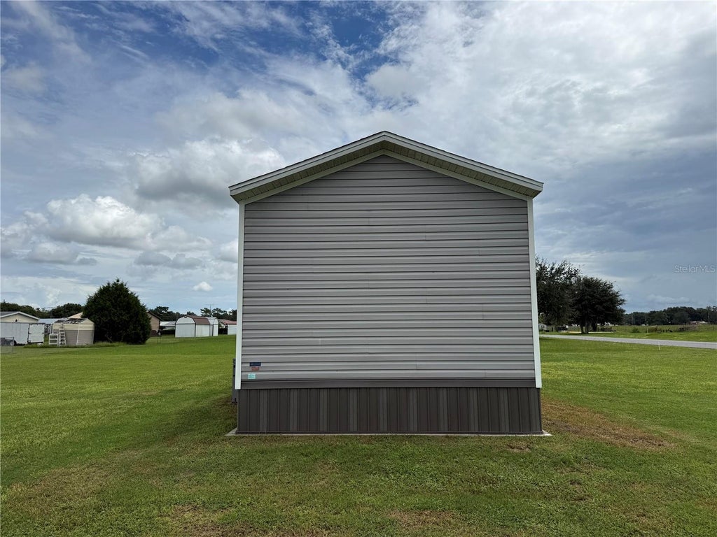 Photo of 1129 NW 12th Ln, Lake Panasoffkee, FL 33538 (MLS # G5117365)