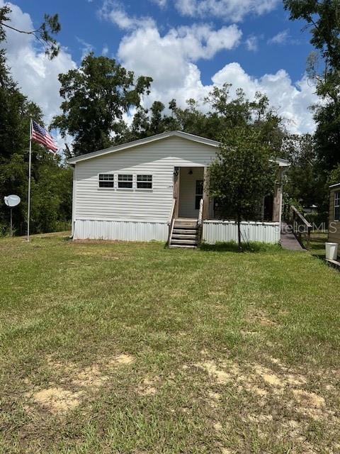 This 4 year old home is tucked away on just over 1/4 of an acre in Gilchrist County but less than 5 minutes to Newberry. It is wheelchair accessible with 3 large bedrooms and 2 baths. This is a Farm House style home with a lot of shiplap in a number of the rooms. The kitchen has a huge gas range and hood with an island that is 10 ft by 4 with plenty of room for guests to eat at. Please note that all the kitchen cupboards have custom drawers that pull out for easy access. There is a sliding barn door to close off the kitchen to the butler pantry which has the microwave and the beverage cooler. This room then leads to a very large laundry room that also serves as space for a freezer. The home flooring is beautiful vinyl plank throughout which make the living room and dining room look very spacious. Going down the hallway you will see a cubby hole desk with 3 drawers and countertop. This is a wonderful place to keep your bills/receipts and stop cluttering the kitchen counter! The guest bath has a tub/shower with a Formica vanity counter top. Two good size bedrooms lead to the master bedroom suite which takes up the entire back of the home. The bedroom is 14.5 X 15.5 which leaves plenty of room for a king size bed and furniture. A stand alone sunken tub, enormous shower, and dual counter sink make this a bath to envy. The property is entirely fenced with wire fencing and has an electric gate entrance. The 12 x 20 shed remains.