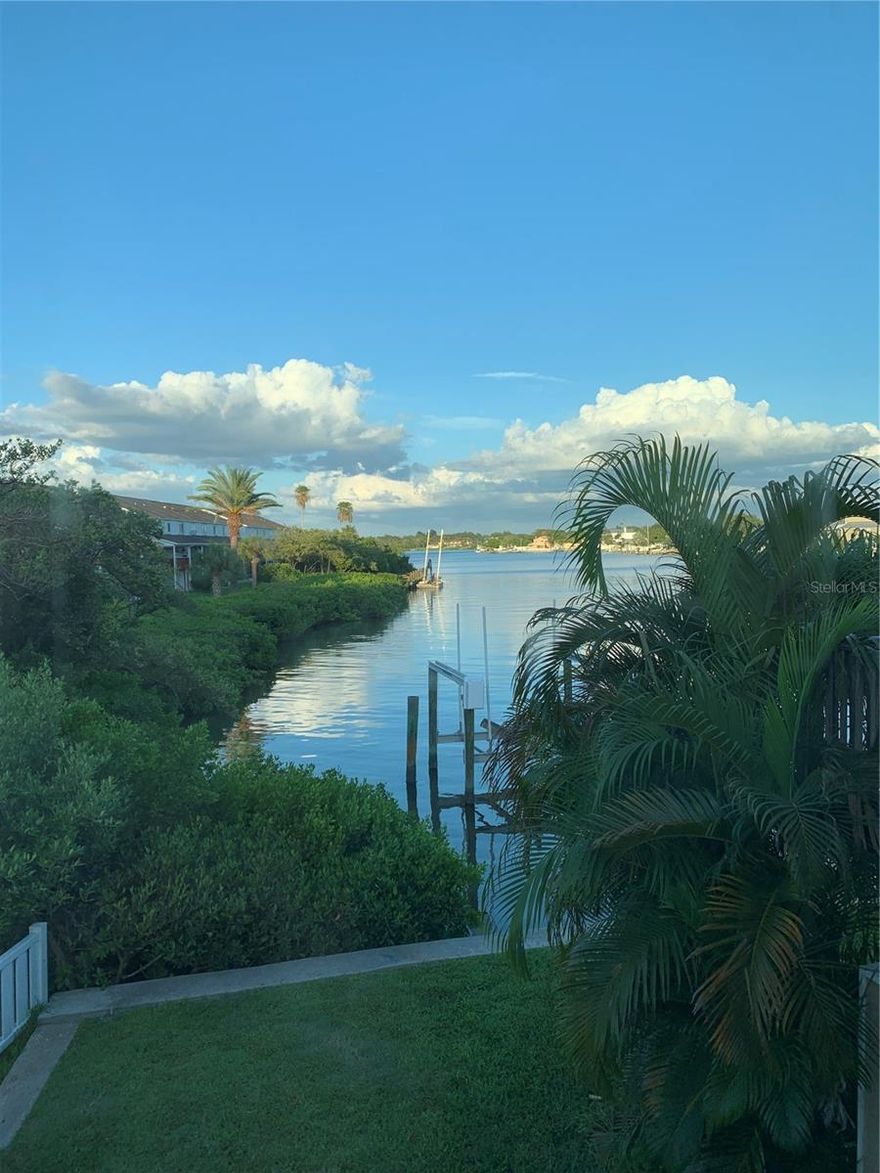 Incredible price reduction on this amazing waterfront home! Breathtaking waterfront 3-bedroom end unit condo/townhome. Amazing intercostal water views on one side and just 252 steps to the pristine white sands of Indian Rocks Beach on the other. It doesn't get any better than this! Light and bright corner unit with all new kitchen cabinetry, appliances and gorgeous counter tops, (2025), new HVAC (2025), new downstairs bathroom (2025), new downstairs exterior French doors and interior doors (2025), and 2019 Hurricane impact windows everywhere. Stunning views from the first-floor kitchen which opens to more waterfront views from the living room and dining room area. A first-floor office/bedroom (garage conversion), bathroom, new full size washer and dryer (2025) and small garage with great storage complete the first level. The water views get even better as you access the 2nd floor from the new stairs (2025) to the master bedroom. There’s an upgraded master bath and frameless shower (2022) and the third bedroom, also light and bright, finishes out the 2nd floor. Relax in the beautiful fenced private patio area outside with block pavers and mature landscaping that provide a secluded retreat, overlooking the water. The community is small and private with only 13 units, making this extra special. With many of our neighbors living here full time, the neighborhood is quiet yet close to everything. Run, ride, walk, explore for miles along the sandy beach. Kayak right from home! Easy walking distance to the local cafes, seafood restaurants, and shops. Only 30 minutes away from Tampa International Airport (20 minutes from St. Petersburg- Clearwater International Airport).
