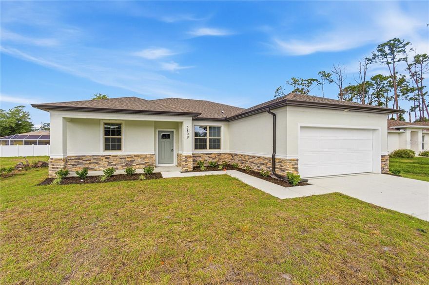 Great price with luxury features and ready now! A newly constructed home with city water and septic system in North Port, with no HOA fees! Great location for quick access to schools, the city center, medical conveniences, parks and the highway. North Salford is not in a high traffic area and only has side streets. This affordable new home is ready for you and is just what you've been looking for! This home has 9'4" tall ceilings, a nice and open layout with a versatile floor plan. The house features 4 bedrooms, 2 full bathrooms, dining room, a living room, an open kitchen and a 2-car garage with 1810 square feet of living space. The living space is well-utilized with high ceilings and many windows providing natural light. The interior features will provide you with the quality and luxury you were looking for in your new home. This home has a split floor plan with the primary suite on one side of the home and the guest bedrooms on the other. The primary bedroom has a tray ceiling and large windows that let in natural light. You'll also enjoy a resort-style bathroom with a spacious walk-in shower with floor-to-ceiling tiled walls and a glass enclosure. It also features a linen closet, double vanity and a large walk-in closet. The living room features large windows and several LED fixtures providing plenty of light with access to the covered lanai. The living room is open to the kitchen, where you'll find a huge center island with extra seating for casual dining and plenty of cabinets. The kitchen features stainless steel appliances, Shaker-style cabinets with crown molding, decorative hardware, subway tile backsplash and granite countertops. The dining room is located at the front of the house, with large windows allowing for plenty of natural light. The home includes luxury vinyl plank flooring in the main living areas and bathrooms for durability and comfort. You'll love these floors! They are easy to maintain and offer a modern design, perfect for new homes. Other features include the same beautiful Shaker-style cabinets with hardware and granite countertops in the bathrooms, 5-inch baseboards, a garage door opener, gutters on the exterior, R38 insulation, a 16 SEER HVAC and much more. Visit our model center and compare the features and quality with other homes and you'll see the difference. We make buying easy for you!