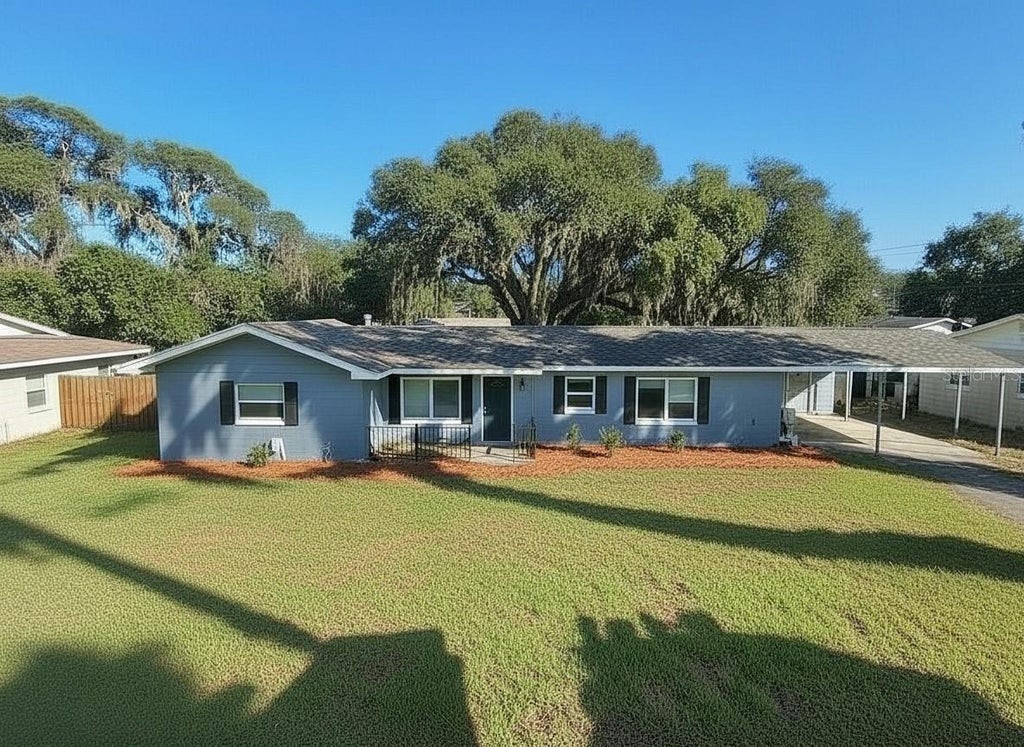 Photo of 14322 Lake Junietta Drive, Tavares, FL 32778 (MLS # O6434462)