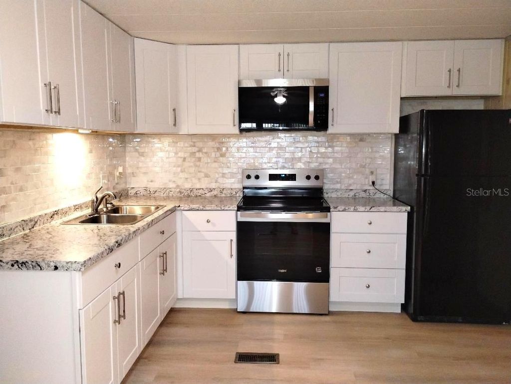 Photo of 9283 Denmarsh Drive, Brooksville, FL 34613 (MLS # W7883661)