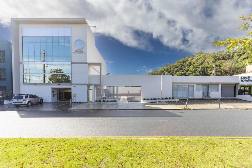 This is a unique opportunity to own three contiguous prime properties with approx. 140 lineal feet of frontage on Roosevelt Avenue in San Juan consisting of approx. 1,230 square meters of land improved with a three-story beautiful office building of approx. 5,538 square feet fully furnished and equipped, a one-story commercial property consisting of approximately 2,762 square feet, and a private paved parking lot in between two buildings for a combined total of approximately 35 parking stalls and 8,300 square feet of total building area.

Roosevelt Avenue acts as the major artery for residents of San Juan, connecting the central business district to the Hiram Bithorn Stadium, along with a series of shopping centers, commercial areas, and professional offices, among the high-density residential area. Other landmarks in the area include Plaza Las Americas Shopping Mall, San Patricio Plaza Shopping Center, Telemundo, Puerto Rico Police Headquarters, Triple-S Headquarters, Plaza Caparra, Claro Headquarters, and Roberto Clemente Coliseum, among many others.

The office building is fully furnished & equipped and considered best in class with premium construction materials & finishes, a 100% backup electricity generator, an elevator with marble finishes, a smoke detection & alarm system, exterior illumination, and parking poles, among other tasteful improvements.

The strategic location on Roosevelt Avenue provides direct access to Highway PR-22 to its north, Jesus Piñero Avenue to its south, and Las Americas Highway to its east, and Martinez Nadal Avenue to its west.