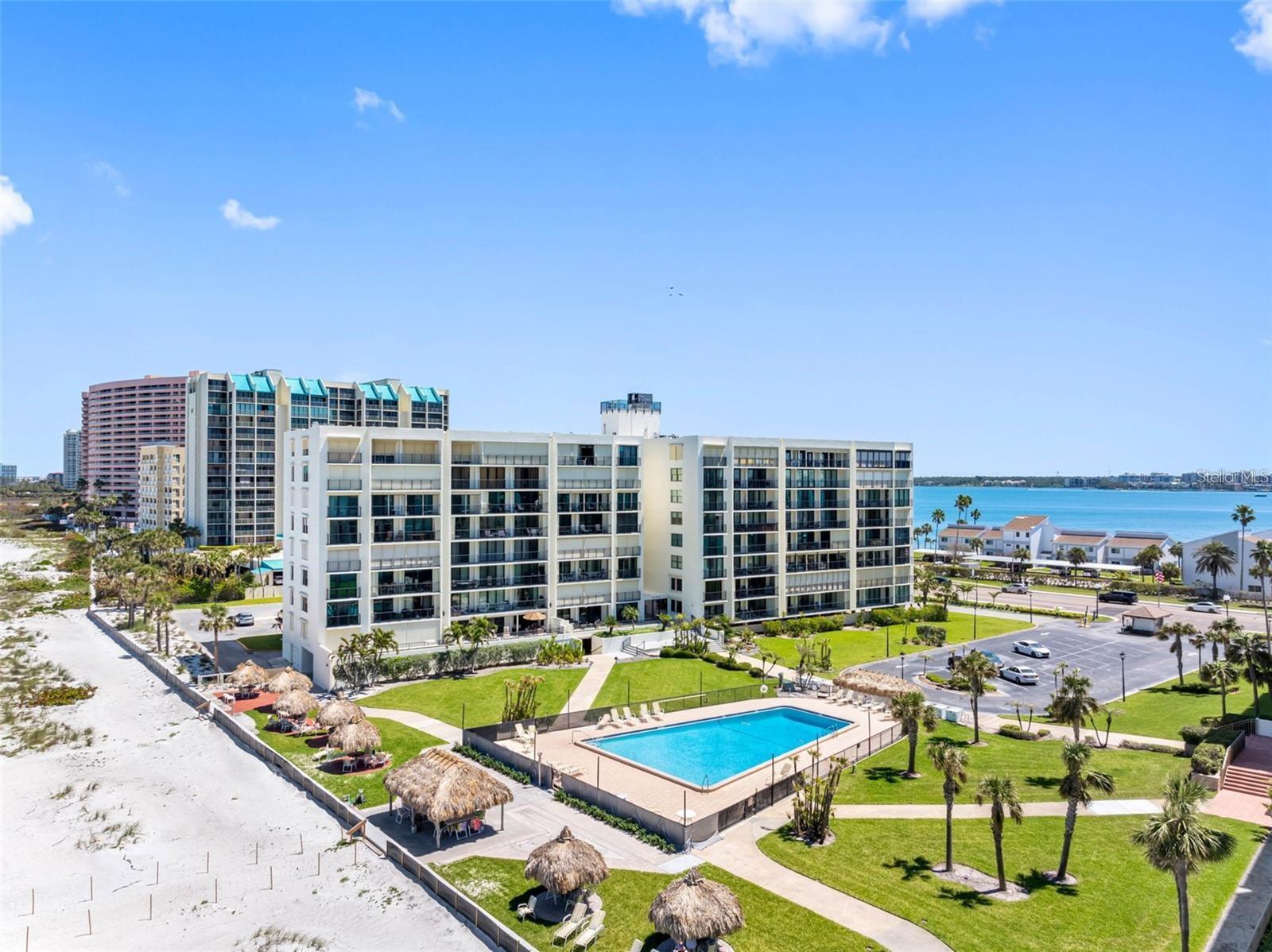Gorgeous oceanfront property in the heart of Sand Key now available for a short or long term lease! Updated and MOVE-IN READY, this 2BR 2BA beach retreat is beautifully furnished and well-appointed with everything you need. The floor plan is open and features tile that runs throughout and upgraded floor to ceiling sliding doors that access a 39 ft. balcony with views of the beach and Gulf. The chef's kitchen is perfectly configured for entertaining and features wood cabinets, granite countertops, and stainless-steel appliances. Both bedrooms are spacious, and the owner's retreat features an en suite bath and generous closet space. There is an abundance of natural light and designer electric solar blinds add to a sense of beachy elegance. Other upgrades include gorgeous wood doors on all of the closets, water conditioner, and new AC in 2021. The washer and dryer are also new! There is a storage locker for your beach toys and also a covered parking spot. 3-month minimum lease required, off season rate is $3250/mo. and $5400/mo. for January, February, and March. No pets please and smoking is not allowed.