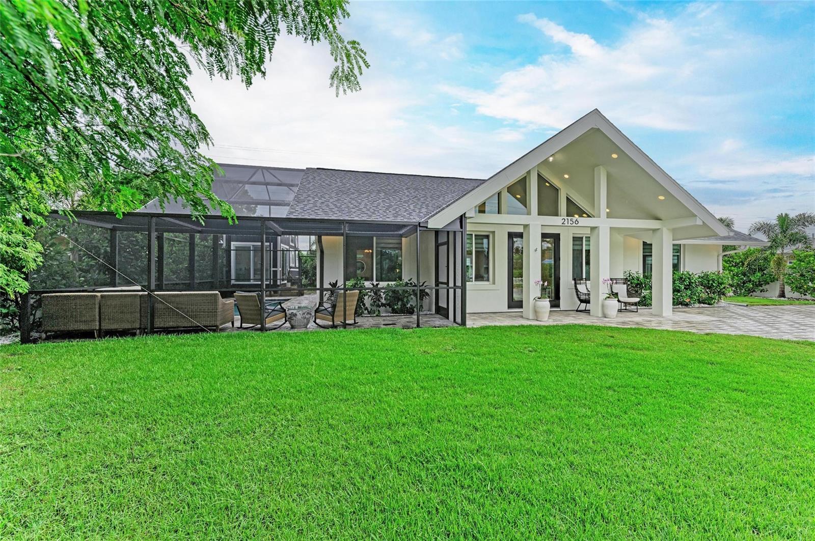 If you’re looking for a true “wow” factor, this stunning new-construction residence delivers. Completely rebuilt from the ground up between 2020–2023, this custom-designed home combines luxury finishes with thoughtful functionality. Step inside to soaring 16-foot ceilings and dramatic exposed beams in the great room, creating an impressive sense of space. The chef’s kitchen is the centerpiece, featuring a striking brown agate back-lit island, Mustang granite countertops, designer backsplash, modern cabinetry with pullouts and utensil organizers, an eight-burner professional range with bread and baking oven, custom vent hood, and upscale appliances—perfect for entertaining. Throughout the home, you’ll find large-format tile floors, custom window treatments, and the option to purchase designer furnishings. Offering 3 spacious bedrooms and 2.5 baths, this residence blends style and comfort seamlessly.
Outdoor living is just as impressive, with a brand-new modern pool and pool cage (completed August 2024), a Jacuzzi brand hot tub, and a private outdoor shower with hot and cold water. The property is professionally landscaped, freshly painted inside and out (August 2025), and boasts impact windows and doors, ensuring safety, efficiency, and some of the lowest homeowners insurance rates available. Additional highlights include a tankless gas water heater, gas and electric dryer connections, and no flood zone location. Situated on one of Sarasota’s highly coveted “Flower Streets,” this property offers rare flexibility: the City of Sarasota permits 7-night minimum rentals, and the home is not subject to Southgate deed restrictions. Just 1 mile south of Sarasota’s luxury waterfront downtown, and less than 3 miles to the world-famous Siesta Key Beach, the home is also walkable to Conner’s Steakhouse, Baker & Wife, shopping, dining, banks, and groceries—all tucked away on a quiet dead-end street. Owner/Agent.