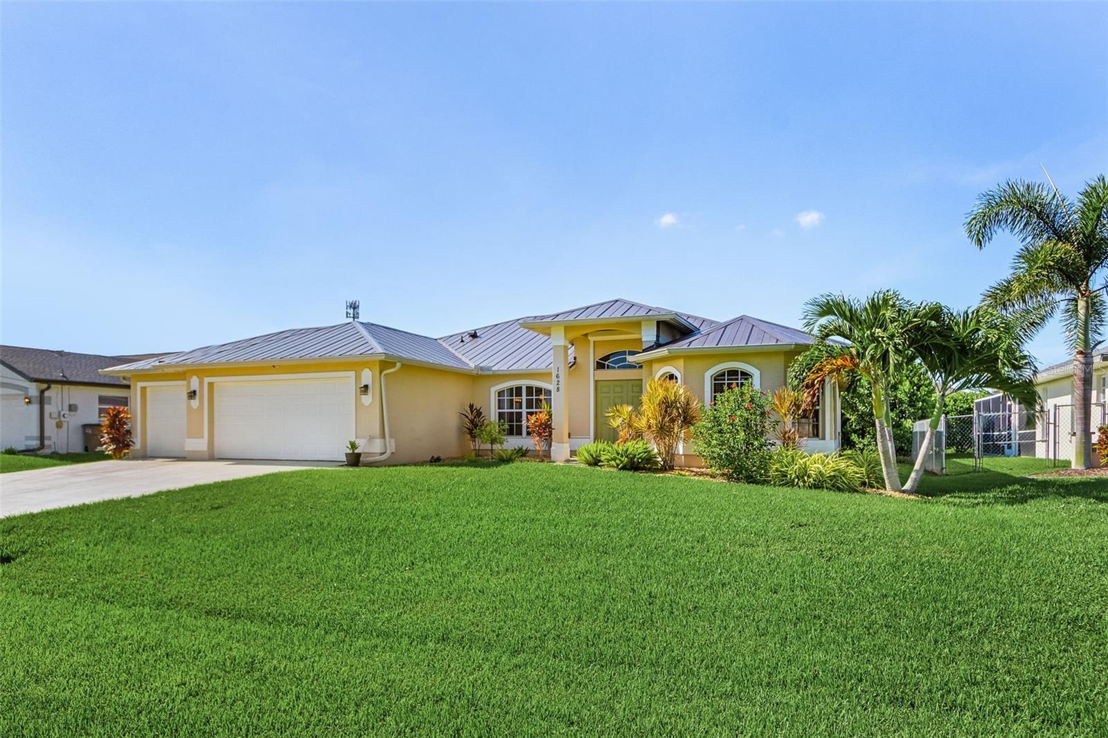 Stunning 3-Bedroom Pool Home in Highly Desirable SW Cape Coral! Welcome to your dream home in one of Cape Coral’s most sought-after neighborhoods! This beautifully remodeled 3 bed, 2 bath + spacious den home offers the perfect blend of comfort, style, and functionality — all close to shopping, dining, and everyday conveniences. Step inside to an open concept layout featuring vaulted ceilings, a split bedroom design, and soft-close cabinetrythroughout. The kitchen showcases granite countertops and overlooks the expansive living and dining area, making it ideal for entertaining. Enjoy the Florida lifestyle in your southern exposure over sized lanai , complete with a heated pool, sun shelf, and a dedicated pool bathroom. The tongue and groove ceilings on the lanai and front entryway add warmth and charm, while electric roll-down shutters provide year-round protection and ease. Car enthusiasts and hobbyists will love the rare 3.5-car garage, offering plenty of space for vehicles, tools, or toys. Recent upgrades include a new metal roof (2022) and a full interior remodel completed in 2022. Don’t miss this opportunity to own a move-in ready home with luxury finishes and an unbeatable location in Southwest Cape Coral!