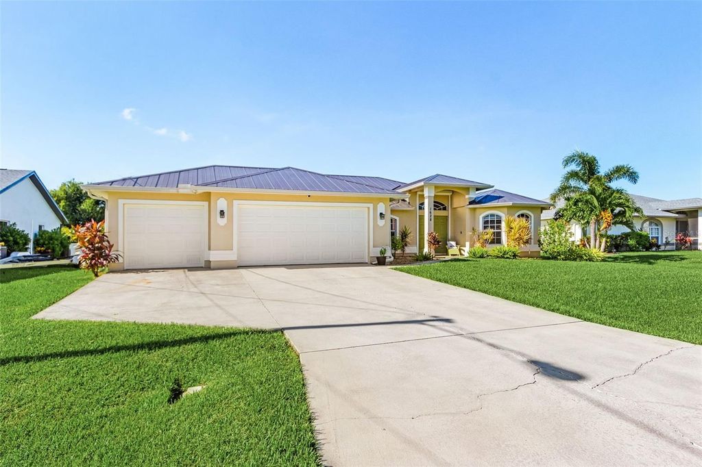 Photo of 1628 SW 44th Terrace, Cape Coral, FL 33914 (MLS # C7514023)