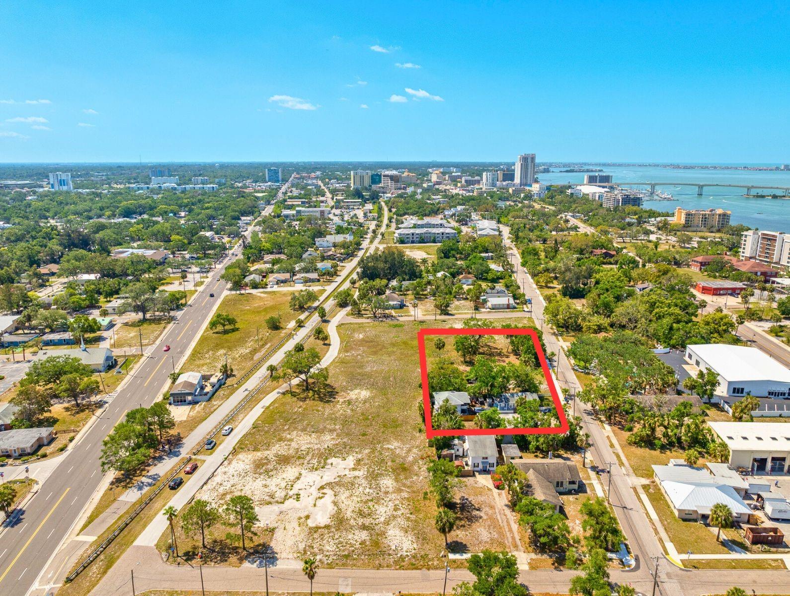 What an opportunity, look at this land in Clearwater, zoned commercial. This is a package listing that consists of 6 adjoining properties: included in the list price is the subject property zoned 1090 Vacant Commercial Land w/XFSB along with three other commercial lots: one zoned 0820 Duplex-Triplex-Fourplex, and one zoned 0110 Single Family. All totaling approximately 1 Acre. All public Utilities and Off Site Retention - Good Road Frontage and size and visibility on a lot that borders the Pinellas Trail - Conveniently located near Downtown Clearwater and Clearwater Beach. The Multi-Family and Single Family are rented and have tenants in place. Do not disturb the Tenants. There is an adjoining group of lots also listed for sale separately making for an additional 2 acres available on the same block, these are under the MLS IDTB8373129. (XFSB : Extra Feature/Special Building - Building area code found on a property record card.)