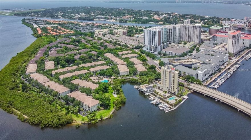 Welcome to Island Place Private Residences on prestigious Harbour Island, where waterfront living offers privacy, convenience, and resort-style amenities within a 24/7 guard-gated community. Ideally located near Downtown Tampa, this beautifully renovated townhome-style condo is just moments from Water Street, Sparkman Wharf, the Tampa Riverwalk, Armature Works, the Channel District, Ybor City, the Tampa Convention Center, and the exciting Lightning games and concerts at Benchmark Arena. Residents enjoy convenient access to fine dining and a pedestrian-friendly Tampa lifestyle, complete with lively nightlife.

This exceptional 2-bedroom, 2-bath residence offers 1,225 square feet of thoughtfully designed living space across three levels, with no upstairs neighbors for added privacy and comfort. The home features a private attached 2-car walk-up garage plus 2 driveway parking spaces for a total of 4 vehicles.

The open layout is filled with natural light and features high ceilings and premium finishes throughout, including 48-inch porcelain plank flooring, crown molding, recessed lighting with dimmers, designer lighting, high-impact windows and sliding doors, stainless-steel railings and handrails, remote-controlled shades, plantation shutters, an interior water shut-off valve, a Nest thermostat, and overhead and shelf storage in the garage.

The stylish kitchen combines beauty and functionality and features 42-inch stacked cabinetry, unique leathered granite countertops and backsplash, stainless-steel appliances, a wine refrigerator, a walk-in pantry, and a stainless-steel apron sink. Double sliding glass doors open to a private balcony overlooking the Garrison Channel, where cruise ships and other watercraft create a stunning waterfront backdrop.

The spacious primary suite features dual closets and an elegant bath with a walk-in shower. The generously sized secondary bedroom includes a walk-in closet and access to a beautiful guest bath with a soaking tub. The washer and dryer are located in the hallway, concealed behind double doors. Residents enjoy resort-style amenities, including a heated pool and spa, tennis courts, a fitness center, a playground, BBQ areas, two clubhouses, waterfront walking paths, pet-friendly areas, and a car wash station.

Experience the finest aspects of living on Harbour Island—it's private, elegant, and truly one of a kind.