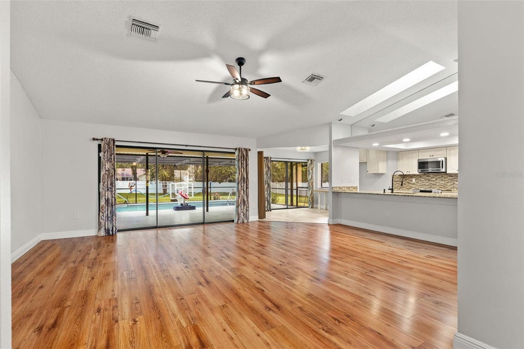Photo of 11201 Rainbow Woods Loop, Spring Hill, FL 34609 (MLS # W7888473)