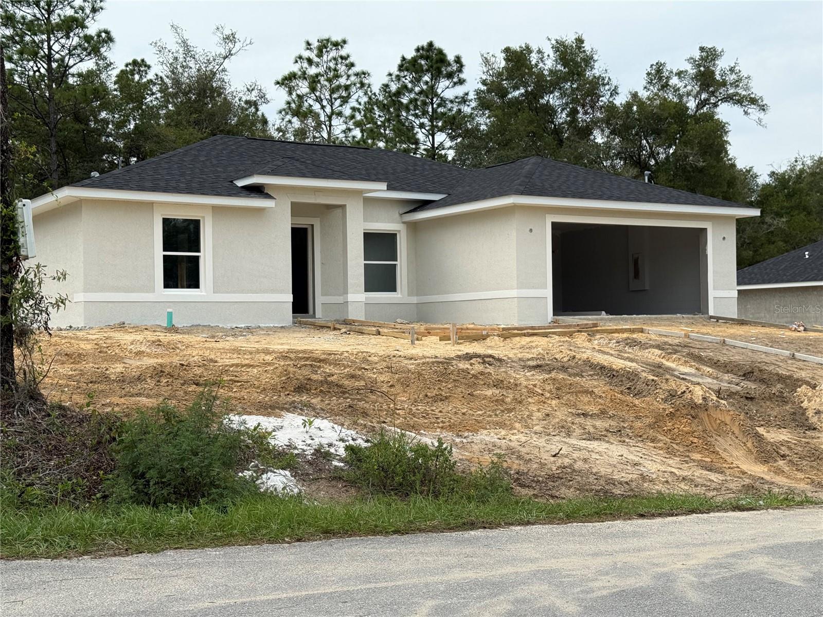 Under Construction. Beautiful new 3-bedroom 2-bathroom 2 car garage Home Block and Stucco finish. Many upgrades including stone countertops, Porcelain Tile Flooring throughout, ceiling fans, soft close cabinetry, Stainless steel appliance package includes: Refrigerator, Range, Dishwasher and Microwave. Versatile kitchen island. The primary bathroom offers a double sink vanity, Walk-in closet, Walk-in shower and tub. No Homeowner’s Association, No Deed Restrictions. Conveniently located. If you are ready to move…This is the one.