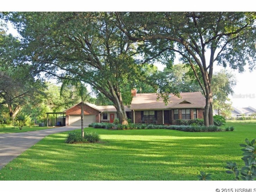 Over an acre & just minutes to town & beach, this home is set in a pristine park-like setting. Lots of remodeling & tiled throughout. Covered screened lanai overlooks beautiful salt pool with propane heated Jacuzzi.   Livingroom has wood-burning fireplace behind electric insert. Substantial cabinet & counter space in remodeled kitchen.  Master suite with bay window & walk-in closet.   Lots of porches, patios & outdoor spaces.  Main living area has new HVAC (Sept 2014).  Florida & family rooms served by separate HVAC but Florida Room not counted under living area space.  The portion of family room that overlooks pool & backyard has visqueen-type windows.  Manual sprinkler system is served by 112â deep well.  Separate fenced pet area.  Thereâs an amazing amount of space for all kinds of storage & hobbies.  Something for everyone! In addition to 2 car garage, thereâs a tandem carport ideal for boat/trailer parking + a large, detached workshop with small 3rd garage ideal for golf cart/motorcycles with small carport & 2 separate storage sheds.   There are 2 separate entrances to this home, so if in-law quarters are needed, the floorplan would be an ideal basis from which to customize to fit specific needs. ;Water: City