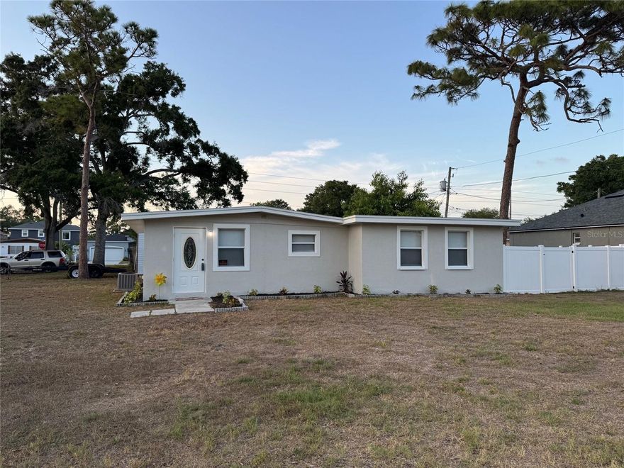 Welcome to this beautifully updated Corner Lot Home in NO Flood Zone in the heart of Pinellas Park on 60 x 110 Large lot offering modern upgrades, prime location, and access to some of the area’s best recreation and future development. Major improvements include a 2022 roof, newer windows, all newer doors, Newer tankless water heater, Newer HVAC system, and Newer stylish commercial-grade Vinyl plank flooring throughout, Painted inside and outside and Bath Tub and walls Refurbished. The exterior is fully fenced with a newer vinyl fence—perfect for privacy, pets, or entertaining.   Enjoy an unbeatable central location just 15 minutes to Downtown St. Petersburg and approximately 20 minutes to Tampa International Airport, making commuting, dining, and travel effortless.  Outdoor and recreation lovers will appreciate being near multiple parks and amenities, including the newly opened Sprowls Horizon Sports Park, a $26M state-of-the-art complex featuring turf baseball fields, multipurpose fields, batting cages, playgrounds, and even an outdoor hockey rink, designed to host tournaments and community events year-round . This major investment is helping transform the area into a regional sports destination and economic hub.  Additional nearby green spaces and recreation include local neighborhood parks, plus easy access to larger Pinellas County destinations like Lake Seminole Park, offering trails, boating, and wildlife viewing, and the award-winning beaches and waterfront parks throughout the county. Looking ahead, the area continues to grow with exciting redevelopment projects such as Davis Commons, a planned city-center gathering space featuring an amphitheater, splash pad, walking trails, and future mixed-use dining and retail—adding long-term value and vibrancy to the community . This home combines move-in-ready upgrades, strong location, and proximity to major recreational and redevelopment projects—making it an excellent opportunity for both homeowners and investors alike.