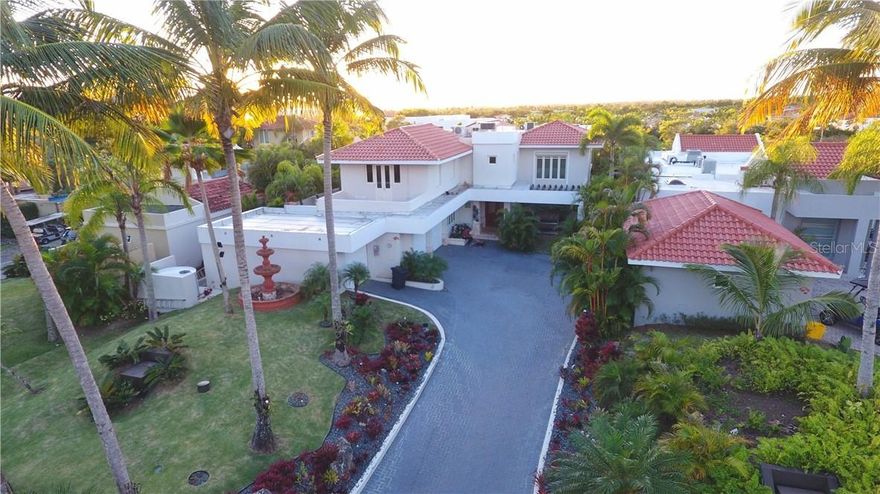 This magnificent home is full of art, fine appointments and spectacular furnishings in the luxurious Dorado Beach East resort community! A spacious, fully furnished and equipped Villa Carbia 2000 model, this beautiful home offers you 4 bedrooms and 5.5 remodeled baths, in immaculate condition with elegant finishes. Starting from the paved driveway leading to a double garage, with elegant fountain, this 2 story home welcomes you. The kitchen is state-of-the-art, extended and recently remodeled, fully equipped, there is a formal and informal dining area, living room, laundry room, 2 family rooms, one of which is extended, 2 breathtaking terraces and patio area right out of a magazine! Among the many extras included are: golf cart, electric storm shutters, diesel generator, water softener system, solar energy system (your electric bill will be approximately $3./month! Dorado Beach East offers you a true resort lifestyle, with spa, restaurants, golf, beach, tennis courts and fitness center, just to name some of the amenities. There is a lot more to see and enjoy in this gorgeous home, so please call me for a showing.