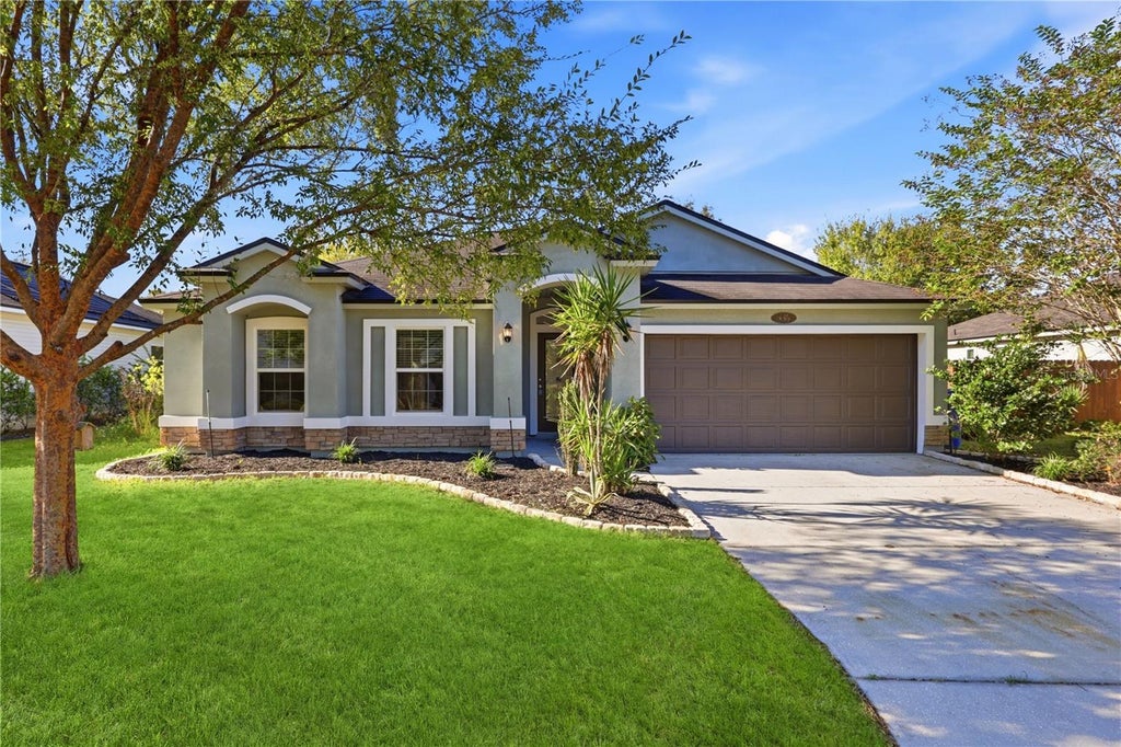Photo of 466 W New England Drive, Elkton, FL 32033 (MLS # O6452343)