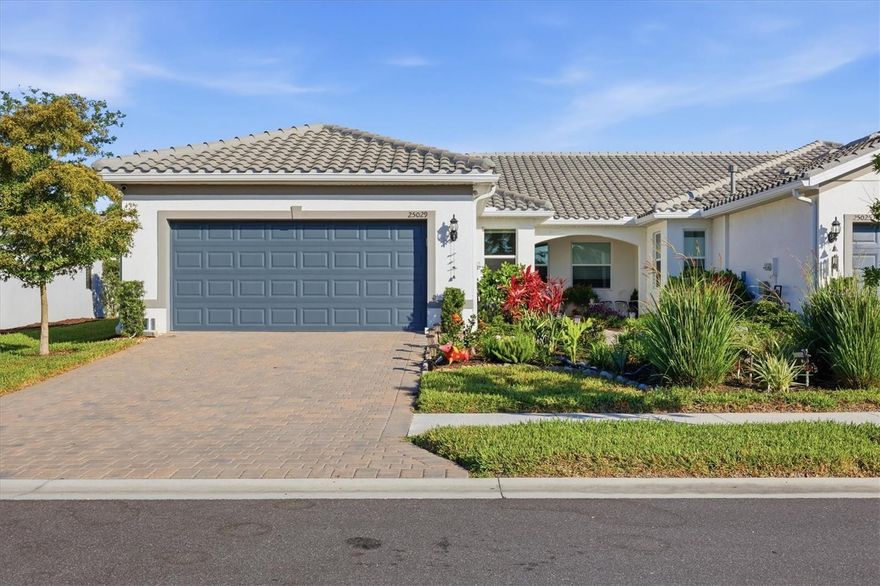 Coastal Living, Perfected — 2.5 Miles from Manasota Key Beach.  Live like you're on VACATION FOREVER!! This isn't just a home—it's a lifestyle upgrade wrapped in $60K+ of builder enhancements, tucked inside Southwest Florida's most amenity-rich gated community. And it's READY NOW!  The Villa: Cascadia Model | 2 BD | 2 BA | Flex Room | 1,600+ SF.  Every detail has been elevated. Quartz countertops gleam in the kitchen and baths. Oversized tile flows through sun-drenched living spaces. The kitchen delivers what cooks actually want: gas range (a rare find), stainless steel appliances, and a casual eating nook for morning coffee or midnight snacks.  The open living and dining area spills onto an extended screened lanai—your new favorite room—overlooking a quiet, private preserve. The flex room with solid doors works as an office, guest suite, or creative studio.
Primary suite highlights:   Generous walk-in closet.   Spa-caliber en suite with dual vanities, tiled walk-in shower, and built-in bench
The kind of bathroom that makes "getting ready" feel like a ritual, not a chore!  Two-car garage with room for paddleboards, beach chairs, and all the gear that comes with living this close to the Gulf.

The Community: Beachwalk by Manasota Key:  This is resort living without the resort prices—low HOA, no CDD.
What's included:   Heated pool with lap lanes and beach entry.  State-of-the-art fitness center.  Tennis, pickleball, bocce courts.  Dog parks and miles of walking trails.   On-site restaurant and tiki bar.   Full-time activities director (yes, really!).   Gated security and that rare commodity: peace and quiet.   Close enough to shopping and dining to be convenient. Far enough to feel like an escape.  
The Bottom Line:  Three years young. Zero construction wait. Every upgrade already done. 2.5 miles to white sand.
Schedule your showing before someone else schedules their move-in. Priced Right, this lovely villa is truly a must see!