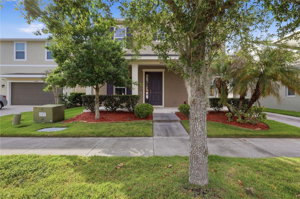 Photo of 32659 Harmony Oaks Drive, Wesley Chapel, FL 33545 (MLS # TB8512949)