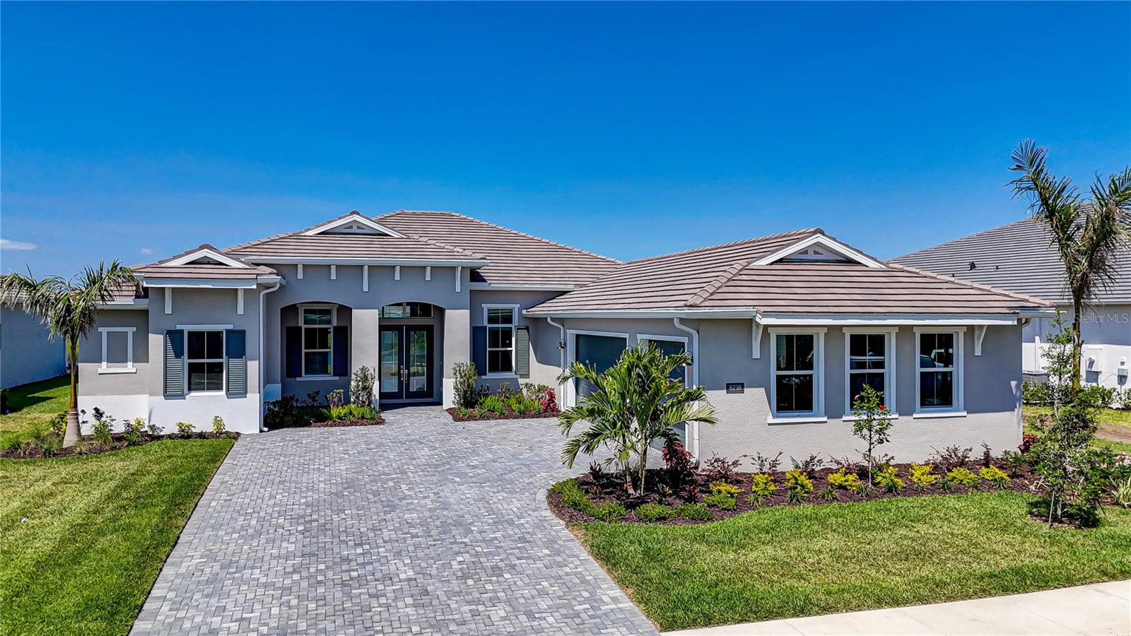 Welcome to this exceptional executive unfurnished annual rental opportunity nestled within the highly desirable community of The Isles at Lakewood Ranch, offering the epitome of modern luxury living in the area. Spanning an impressive 3300 square feet, this immaculate residence is meticulously designed to blend sophistication with comfort. As you enter, you will be greeted by the inviting open-concept layout that seamlessly blends the living, dining, and kitchen area together with plentiful amounts of natural lighting illuminating the space. The home features 12-foot ceilings throughout the home including the 4 bedrooms and 3.5 bathrooms, with the master suite positioned on the left side for ultimate privacy and relaxation, while the other three bedrooms reside on the right, offering convenience and functionality. The heart of the home is the gourmet chef's kitchen, boasting brand new stainless-steel appliances, including a gas stove, and an oversized island with eating space, perfect for culinary adventures and entertaining friends and family alike. Retreat to the spacious master suite, offering a serene sanctuary with its well-appointed ensuite bathroom featuring dual vanities, a luxurious frameless walk-in shower, and ample closet space. Step outside onto the lanai and enjoy the tranquil surroundings of the community, with lush greenery and scenic views of the pond providing the perfect backdrop for outdoor relaxation and gatherings. Residents of Isles of Bayview enjoy access to an array of amenities, including two gated entrances, a clubhouse with a fitness center, tennis and pickleball courts, a dog park, resort style pool, and scenic walking trails, ensuring there's something for everyone to enjoy. Conveniently located near shopping, dining, and entertainment options, and just a short drive from the pristine beaches of Sarasota and Anna Maria Island, this is an opportunity not to be missed. Schedule your tour today and experience luxury living at its finest in Lakewood Ranch.