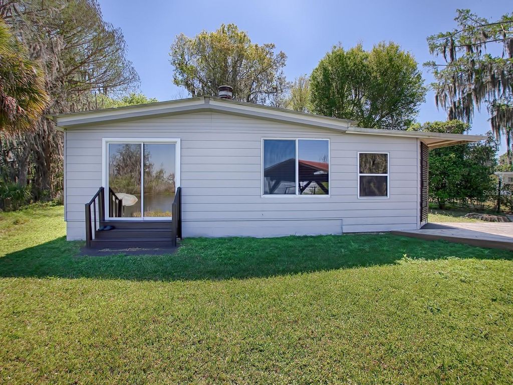 Photo of 426 NW 5th Road, Lake Panasoffkee, FL 33538 (MLS # OM712713)