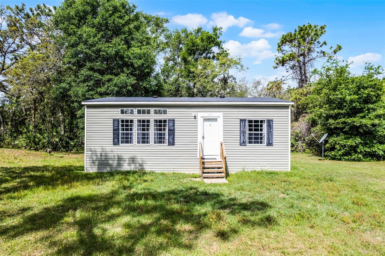 Welcome to your new home in Webster, FL. This charming home sits on a spacious 0.47-acre corner lot, was constructed in 2020 and has no HOA. This cozy retreat features a primary suite with ensuite bathroom, a second bedroom, and an additional full bathroom. Enjoy a decent-sized living room perfect for relaxing, flowing into a comfortable kitchen with a breakfast nook for casual dining. Convenient washer/dryer hookups add practicality. Nestled on a generous lot, this home offers ample outdoor space and endless potential--ideal for first-time home buyers or those seeking a serene lifestyle.
