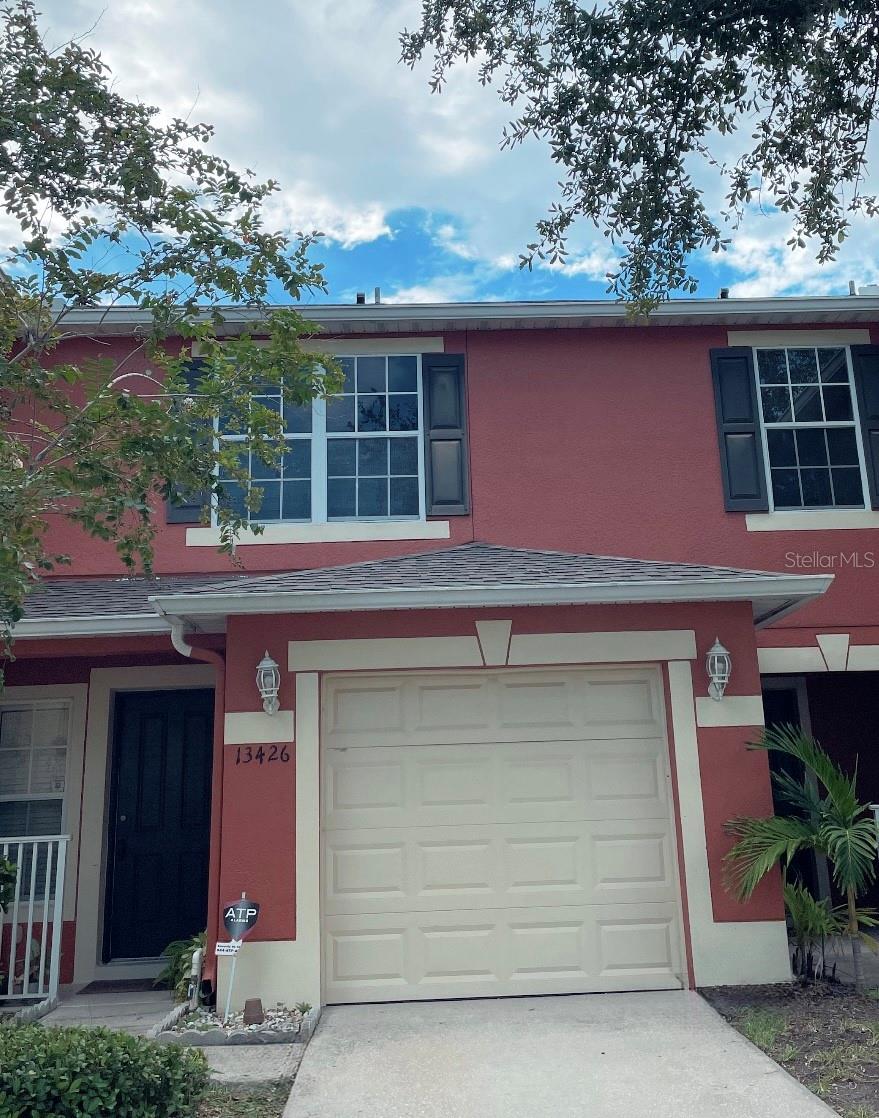 Photo of 13426 Tea Rose Way #105, Orlando, FL 32824 (MLS # O6438188)