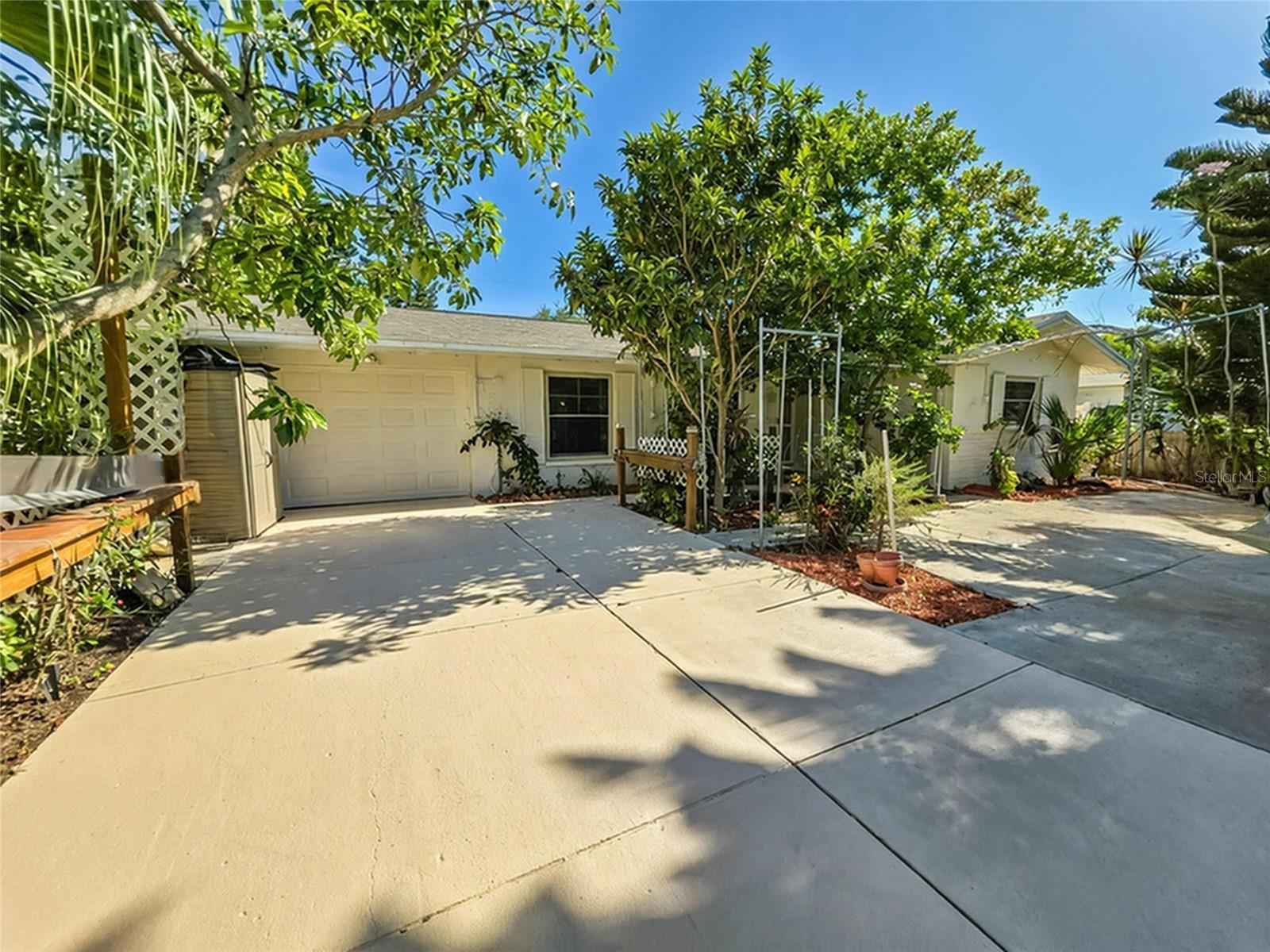 One or more photo(s) has been virtually staged. Welcome home to this Charming 3-bedroom, 2-bath POOL home with NO HOA! Stepping inside, you’ll be greeted by a bright and open floor plan with a spacious living room. The kitchen features beautiful GRANITE countertops, ample prep and storage space, counter seating and opens to the dedicated dining space and living area. Gather in the either the Living Room or Family Room to enjoy your favorite movie or serene outside views. With three bedrooms and 2 UPDATED BATHROOMS, there’s ample room for everyone. Maintenance is fast and easy with NEW LUXURY VINYL PLANK FLOORING through the main living area. Enjoy a refreshing swim in the pool, or soak your cares away in the spa. This home boasts energy efficient living with its OWNED SOLAR PANELS providing low electric bills & Propane Gas to Heat your pool. Lush landscaping surrounds the home and provides fruit trees and avocado tree. You’ll love being just minutes away from Clearwater Beach, shopping, dining, and all that Clearwater has to offer. Don’t wait—schedule your private showing today!