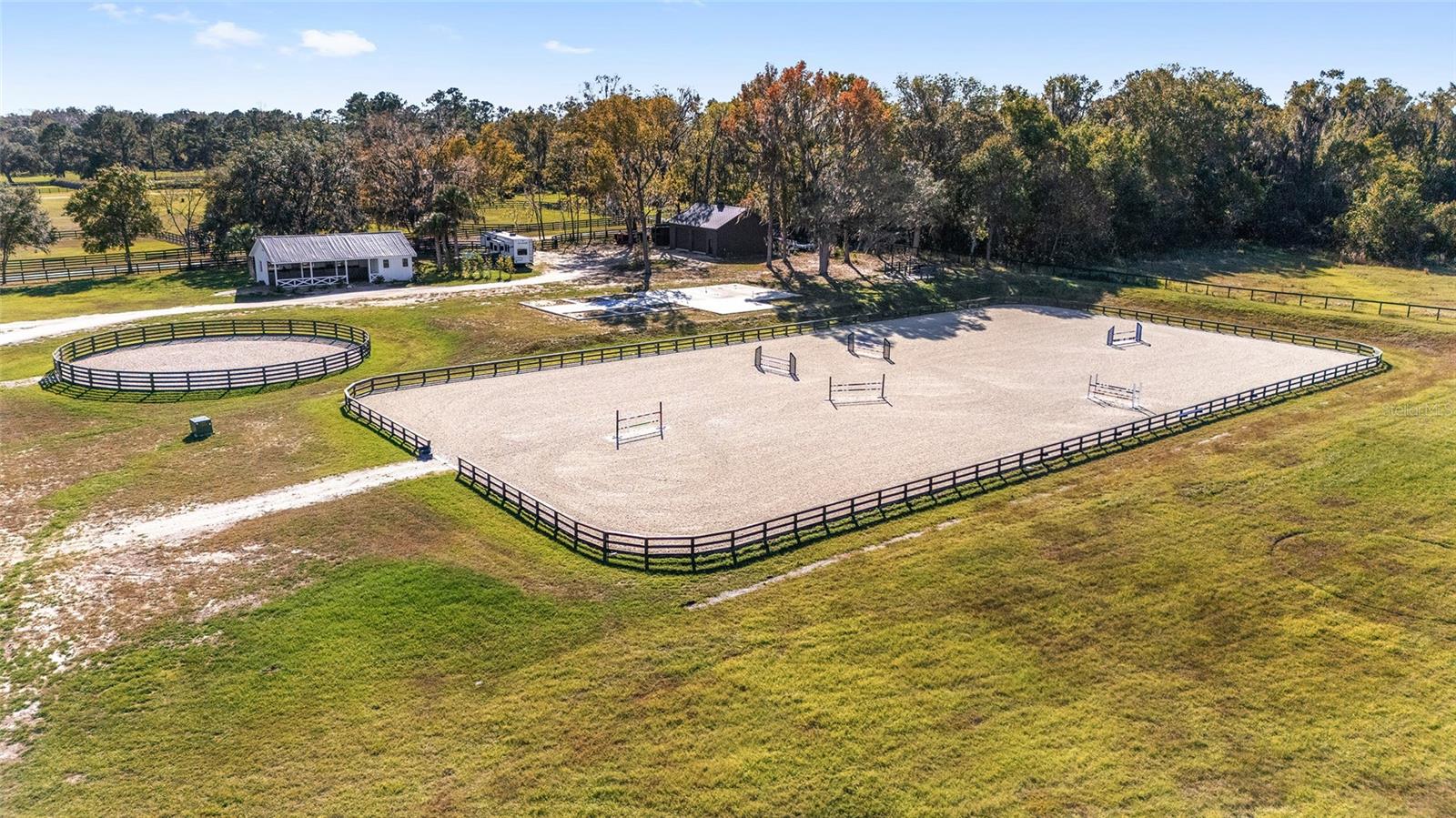 Absolutely charming 10-Acre Ocala Florida Farm in the desirable area of Northwest Marion County,
A Rare Gem Near the World Equestrian Center -
Nestled just six miles from World Equestrian Center, this picturesque 10-acre farm in Ocala is a rare find, offering a perfect blend of modern upgrades and equestrian excellence. Construction on a 6 stall center isle barn was also started
The property boasts a spacious 3-bedroom, 3.5-bathroom home, that was recently expanded in 2024 with a stunning new addition. The original home has been updated, featuring a beautifully renovated kitchen with a gas range and a cozy fireplace.
Equestrian enthusiasts will love the state-of-the-art 110’x240’ GGT footing arena and 70-foot round pen, both crafted by the renowned Worldey Martin Arenas. The newly built beautiful three-stall shed row barn includes a heated and cooled large tack room complete with a washer, dryer, hot water, and a powder room, ensuring convenience and comfort.
Additional features include
The concrete pad has been poured as well as the plumbing for a 6 stall center isle barn -located next to the arena
A brand new 30’x40’ shed for farm equipment, All paddocks equipped with water access, A brand-new 5 HP well with a generator to fully back up the barn, New four-board fencing with run-ins, among other updates
This property is a turnkey dream for horse lovers and those seeking a serene rural retreat with top-tier amenities. Schedule your private tour today to experience the charm and functionality of this exceptional Ocala farm. Seller is licensed Florida Real Estate Broker