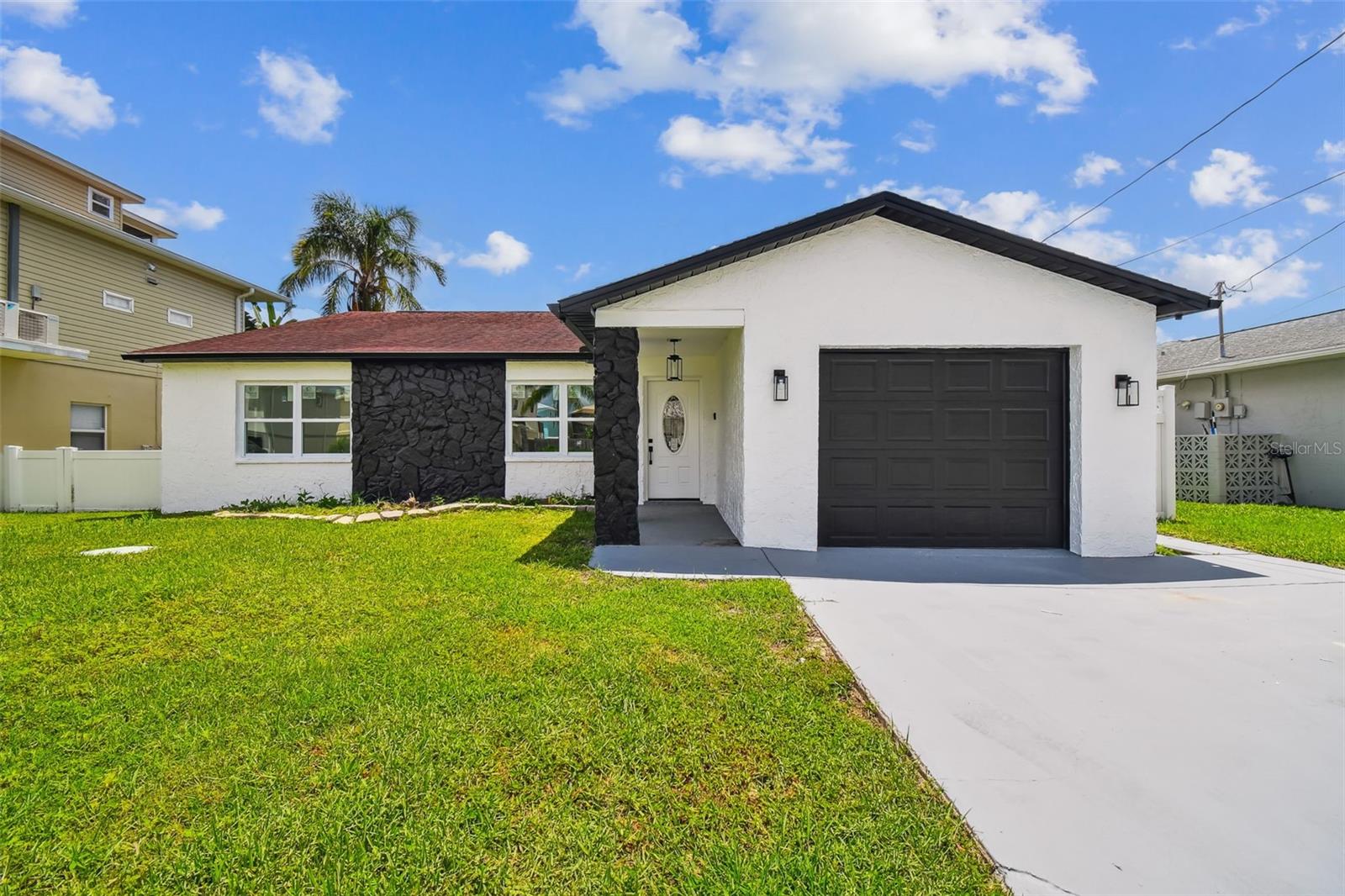 Experience the ultimate Florida waterfront lifestyle in this beautifully remodeled 3-bedroom, 2-bath home with direct canal access! Perfectly positioned in a boating community with a private neighborhood boat ramp, this property offers effortless access to the open waterways for fishing, cruising, or sunset rides. Step inside to an open-concept floor plan where natural light pours across stylish finishes and modern upgrades. The kitchen flows seamlessly into spacious living and dining areas, creating the perfect space for entertaining. Both bathrooms have been tastefully updated, and the primary suite offers a private retreat. New impact rated windows throughout. Outside, enjoy your own dock-ready canal frontage—just bring your boat or kayak and go. Conveniently located near dining, shopping, and coastal attractions, this is Florida living at its best!