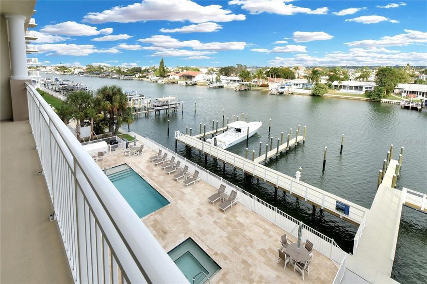 Exceptional value, best priced unit in the building by a wide margin. Welcome to Dolphin Harbour Condominiums, a stunning waterfront community built in 2023 along the highly sought-after Island Way corridor in the heart of Clearwater Beach. This never-lived-in 4th floor condo offers nearly 1,850 square feet of luxurious living space with breathtaking Intracoastal and marina views. All new in 2023 including roof, HVAC/air conditioning, water heater, elevator, electrical and plumbing systems, all flooring, and appliances. Dolphin Harbor is an exceptional community for boat enthusiasts situated on deep intercoastal waters with the optional deeded boat slip (50x22 sq ft) available to purchase, including ownership of the land beneath it, with a recently approved variance for the addition of a boat lift. This boat slip is not incuded in the purchase price listed herein.

The beautifully designed 3-bedroom, 2-bath residence features an open floor plan, wood-look tile flooring throughout, and floor-to-ceiling impact sliding glass doors that fill the home with natural light. The chef’s kitchen is the centerpiece of the home with quartz countertops, a large island with bar seating, stainless steel appliances, abundant wood cabinetry, under-cabinet lighting, and a spacious pantry.

The private primary suite offers balcony access, a large walk-in closet, and a spa-inspired en suite bath with dual sinks, quartz countertops, and an oversized seamless glass shower. A split-bedroom layout provides privacy for guests, while the expansive 30-foot balcony overlooks the marina, Intracoastal Waterway, and resort-style heated pool and spa — the perfect setting to enjoy coastal sunsets and waterfront living.

Additional highlights include two reserved parking spaces, including one under-building space, interior laundry, and resort-style amenities. Ideally located just minutes from Pier 60, waterfront dining, boutique shopping, Clearwater Marine Aquarium, Sand Key Park, and Caladesi Island State Park, Dolphin Harbour offers the ultimate blend of luxury, convenience, and coastal lifestyle.
