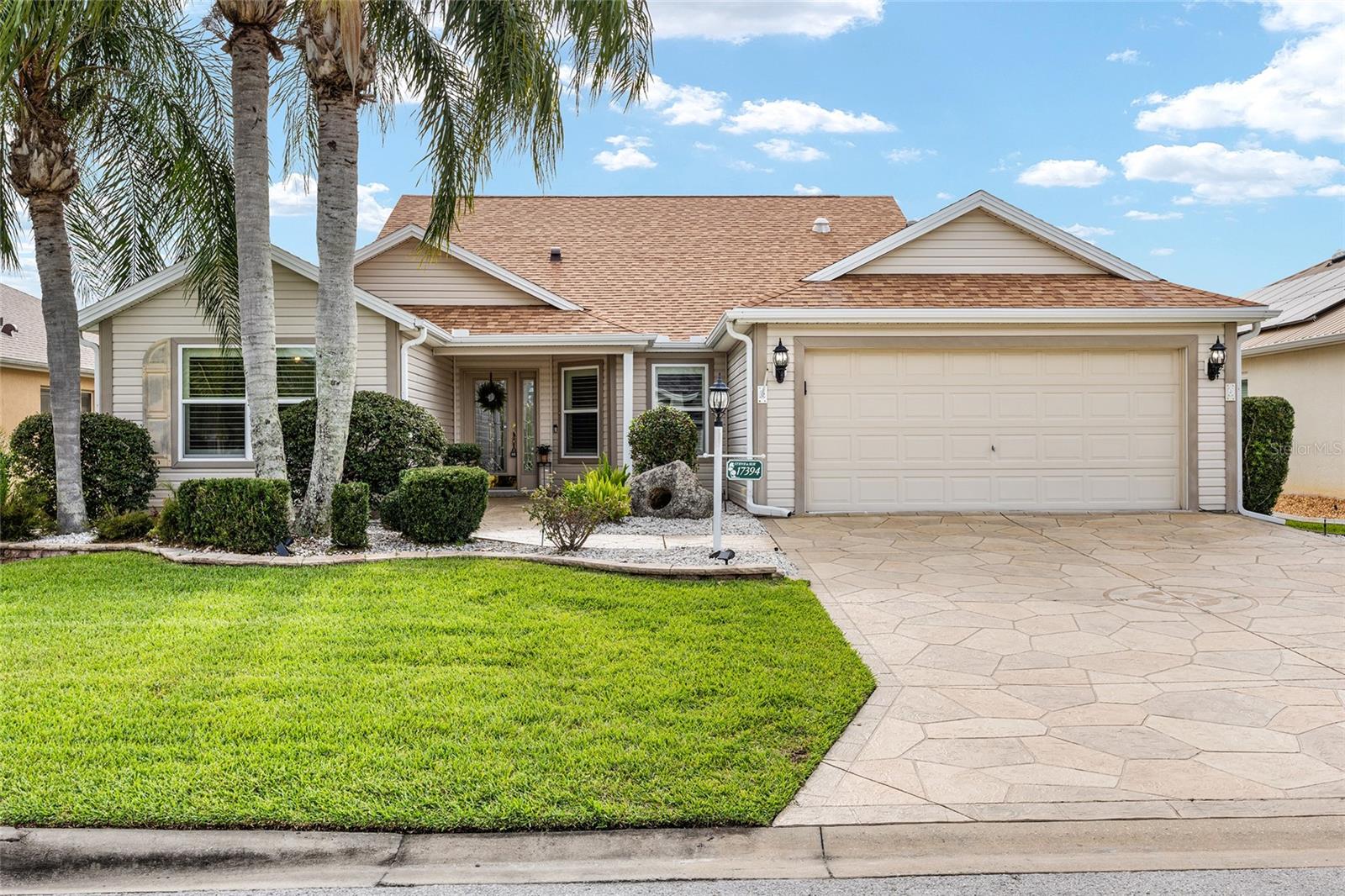 Extremely popular Designer Series home in the Village of Chatham community of The Villages. Just 1.5 miles from the Nancy Lopez Country Club and Restaurant, and also right down the street from Oakleigh Executive Golf Course. This home features a wonderful large and open layout, with high ceilings and lots of light throughout, and NO BOND! Wonderful extra touches, such as specialty entry windows and door, upgraded flooring, kitchen lighting, and built ins! This lovely home is perfect for entertaining, with a layout that is welcoming to guests, and plenty of room for everyone! The kitchen features wood cabinets, and a light and bright breakfast area, while the dining area is conveniently off of the kitchen. The open living area looks out onto a large lanai, which is fully enclosed for all season use, and beyond that is an extended patio, which contains a hot tub, and has a bird cage enclosure! The primary suite has direct access to the lanai, as well as elevated ceilings, two walk in closets, and an en-suite bathroom. The second bedroom has a murphy bed cabinet, which gives the homeowner much more usable space in the room to make it a hobby/workout/craft room. The third bedroom/flex room has a built in office area as well as storage cabinets and another built in murphy bed, expanding the guest options. The garage features built in cabinets for your storage needs. This is a highly sought after floor plan, so don't miss your opportunity to be one of the first to see this beautiful home!