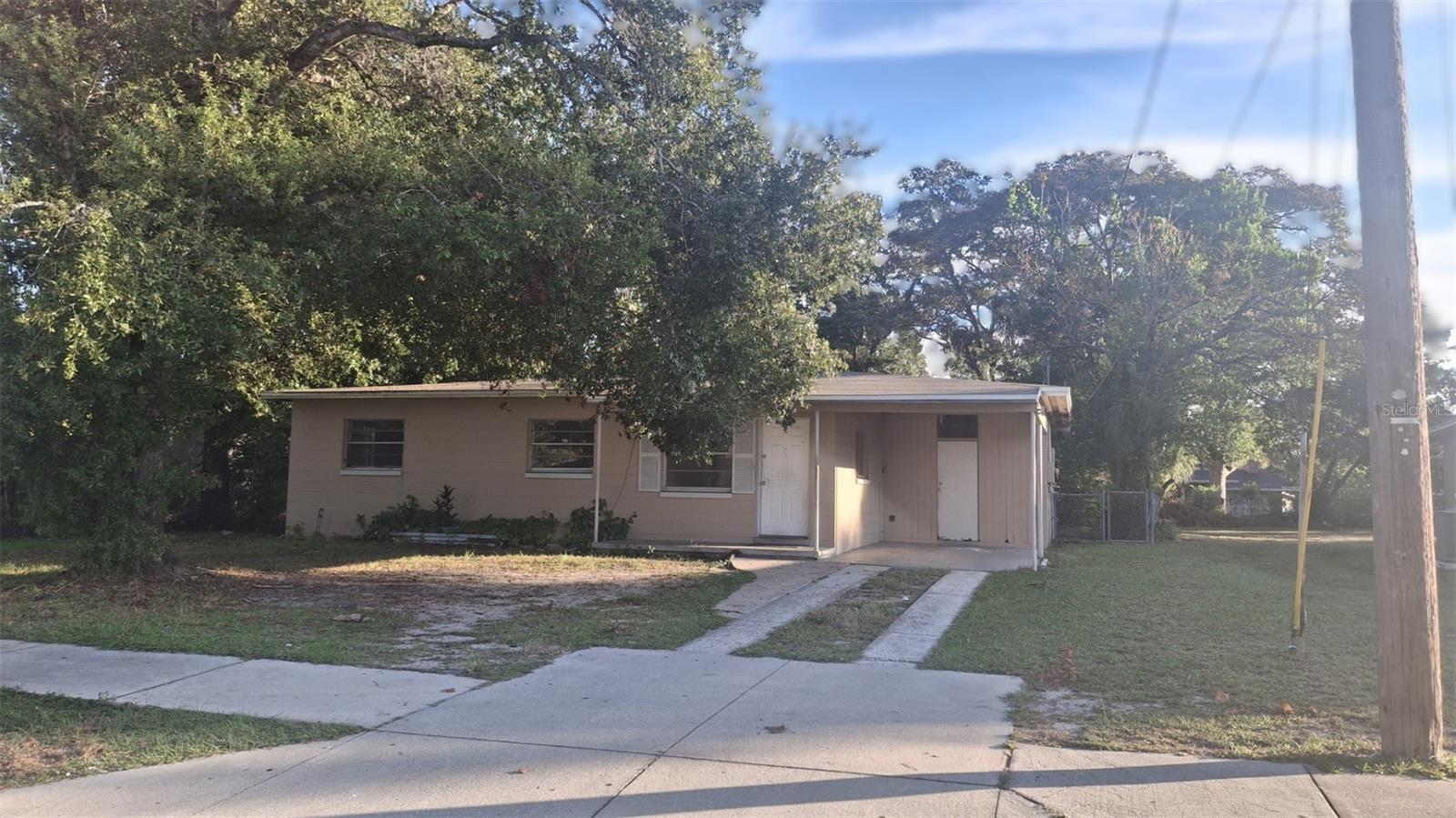 Fixer-Upper Opportunity – CASH BUYERS ONLY! This 3-bedroom, 1-bathroom home is full of potential and ready for your personal touch. It needs TLC but offers a spacious layout with separate living, dining, and storage rooms—perfect for creating a customized living space.  1-car carport is located on the right side of the house for convenient parking. Enjoy a large, fenced-in backyard—ideal for outdoor activities, pets, or future landscaping projects. Great investment opportunity or project for the right buyer! Sold as-is. Serious inquiries only.