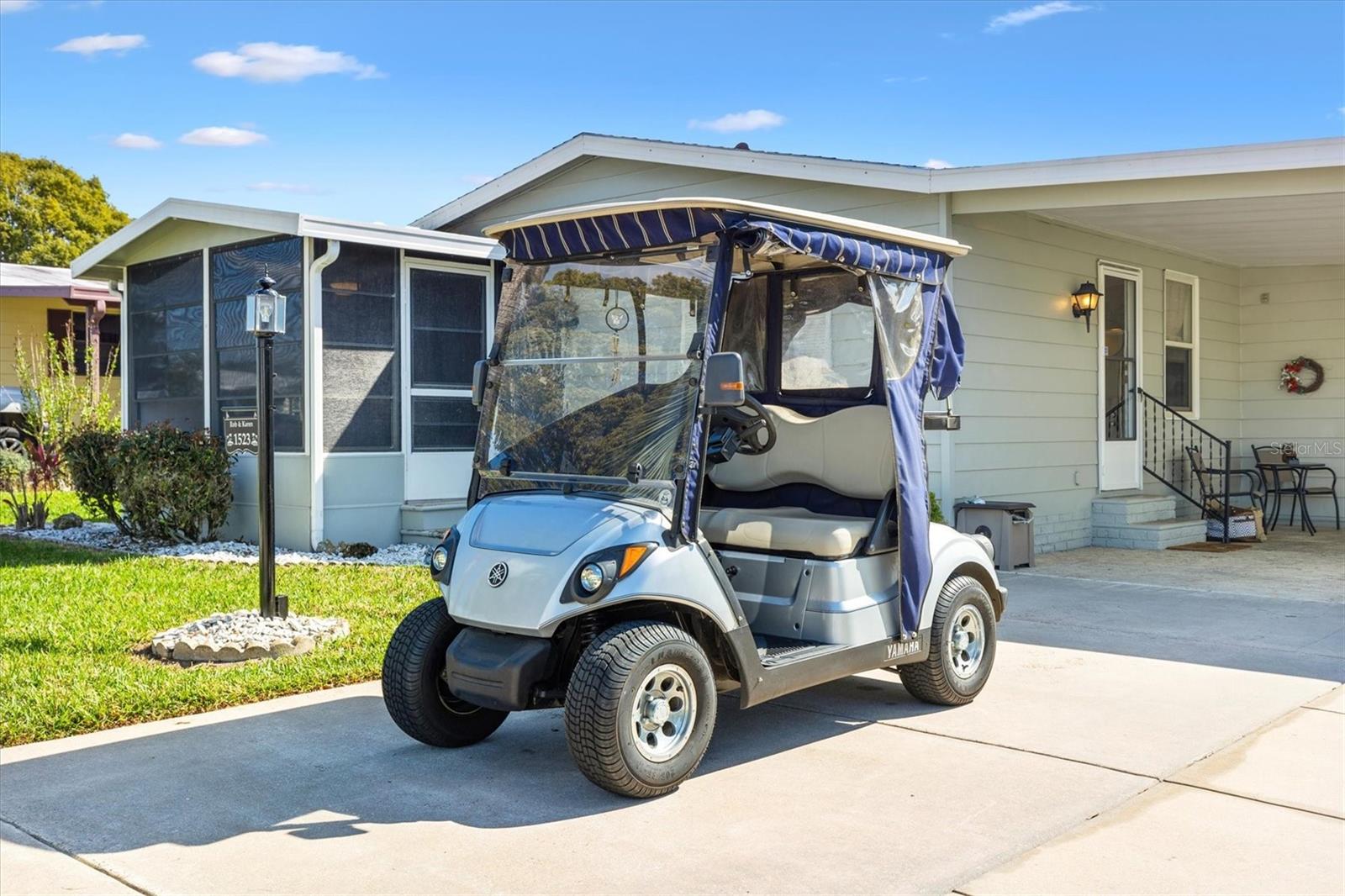 WOW Check out the Price Reduction. Welcome Home! 2-bedroom, 2-bath **TURNKEY**2022 Roof** 2021 HVAC** AND **2018 Yamaha Gas Golf Cart!** Ready to move in or for an addition to your Investment Portfolio.
The cute kitchen is well-appointed, with light-colored cabinets, stylish appliances, and newer fixtures that are perfect for cooking and entertaining. The home boasts a spacious yet cozy layout, ideal for comfortable living. Enjoy the lovely yard, perfect for relaxing or socializing, and take advantage of the home's prime location—just a short golf cart ride to the Town Square, where shopping, dining, and entertainment await.
Offered turnkey, this home includes furnishings for a seamless move-in experience. Plus, a 2018 Yamaha golf cart is included, making exploring all that The Villages. This is a fantastic opportunity to enjoy the vibrant lifestyle of this sought-after 55+ community! Equal Housing Opportunity.