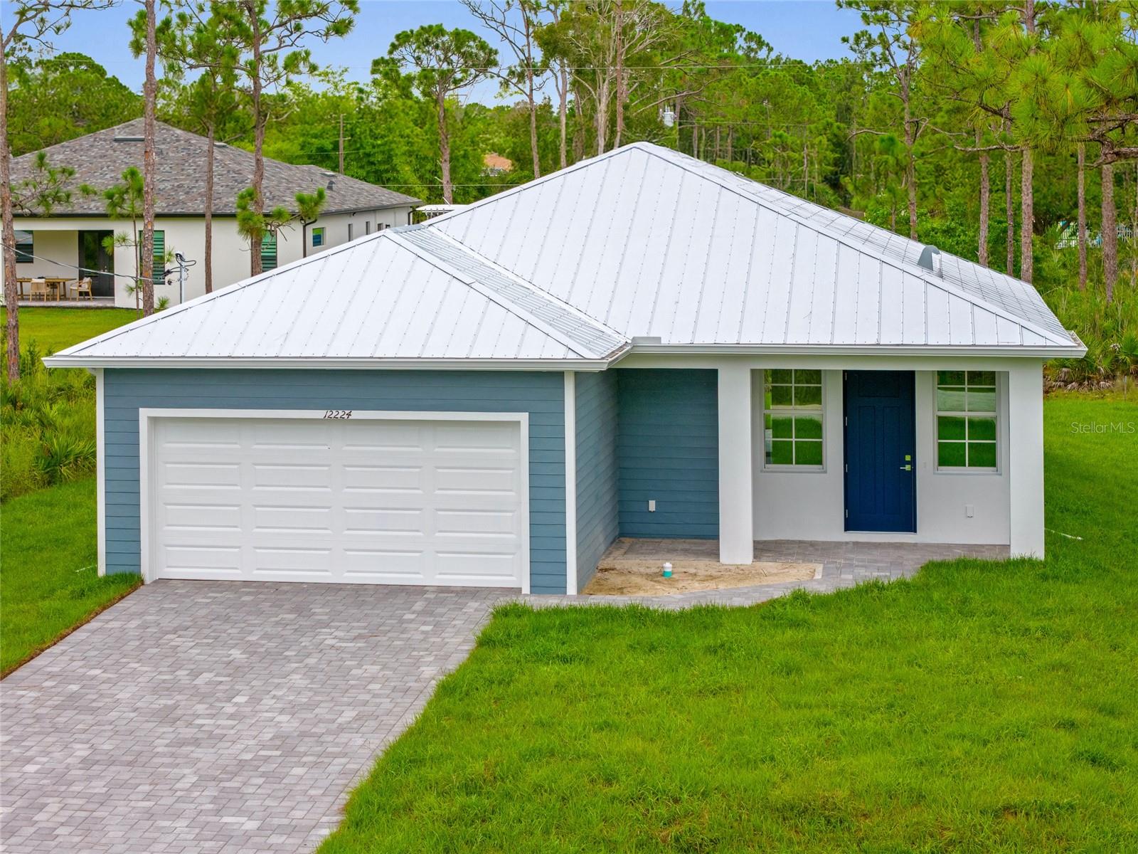 NEW CONSTRUCTION! GREAT INVESTMENT OPPORTUNITY OR PERMANENT RESIDENCE! 2 BEDROOM, 2 BATH, 2-CAR GARAGE HOME IN TROPICAL GULF ACRES! Beautiful open floor plan features 1,199 sf of living space, 9’ 4” ceilings, 8’ doors and luxury vinyl flooring throughout. Well-appointed kitchen offers white cabinetry, quartz countertops, stainless steel appliances, pantry storage and breakfast bar overlooking dining area with slider to lanai. Primary suite features a walk-in closet and private bath with walk-in shower. Guest bedroom and guest bath located in rear of home. Additional notable features include tiled showers, inside laundry room, paver driveway and patio, hurricane impact windows, and no HOA fees or CDD. Plenty of room for a pool. You'll love being conveniently close to I-75, restaurants, shopping, parks, golf, and just a short drive to downtown historic Punta Gorda, noted for its world-class fishing, boating, community events, and entertainment. Don't miss this incredible opportunity! Schedule your private showing today and make this beautiful home yours!