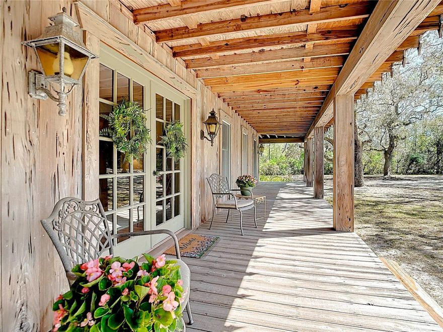 36.8 ACRES OF PRISTINE, WOODED LAND, PRIVACY AT IT BEST and a ONE-OF-A-KIND THREE STORY HOME! Cross between old Florida and Swiss chalet architecture.  Clad entirely in old growth pecky cypress and situated among canopying oaks, towering long leaf pines, and stands of old cypress trees, this home was meticulously designed and constructed to blend seamlessly into its natural surroundings.  Upon driving up the tree covered driveway, a 72 foot wide front porch welcomes you with plenty of seating space to just relax and enjoy the outdoors.  As you walk through the double doors at the entry of the home you are greeted by a large foyer and a living room with a CATHEDRAL CEILING, EXPOSED WOOD BEAMS, a WOOD-BURNING FIREPLACE, and tons of natural light flooding in from windows all the way around allowing the beauty of the private land to be seen from every angle.  It’s the kind of space where you can watch deer or turkeys pass by at sunrise or listen to the call of owls from the comfort of your sofa. As you continue through the home, you are treated to woodland views from every room. Connected to the breakfast nook and family room is a large, screened back porch providing another perfect place to slow down and unwind while listening to the swaying pines and vibrant birdlife and watching butterflies float by. The home offers two beautiful loft areas perfect for reading or just having a quiet moment to reflect. These loft areas look out to the wooded property as well as overlooking the foyer and beautiful living room. The largest guest bedroom, which could be a secondary primary suite, has a walk-in closet and is pre-plumbed to have its own private bathroom. A large balcony connected to this bedroom and the loft, offer more space to take in the gorgeous landscape and even stargaze in the dark, night sky.  You will find an unfinished attic on the second floor that can be accessed through a full size door. This area is great for storage or could easily be finished as additional living space. As you walk up the stairs to the THIRD FLOOR you will walk into another attic space with windows and natural lighting, and this area could also easily be converted into more additional living space. This home has a SECOND HOME ON THE PROPERTY that has power but just needs water hook up and A/C. With solid heart of pine wood floors, this would be a PERFECT ART STUDIO, WORKSHOP or ADDITIONAL COTTAGE DWELLING UNIT. Across the road, OPEN PASTURE ADDS POTENTIAL FOR HORSES. Let your imagination run wild with the ENDLESS OPPORTUNITIES that this property has to offer with even current future land use allowing for one residents per 5 acres of land also allowing additional dwelling unit, barn, stables, etc! GREAT FUTURE POTENTIAL WITH THIS PROPERTY! This home is located in a beautiful, quiet, rural area tucked away from the hustle and bustle yet has easy access to anywhere you want to go! This home is located about a half hour to all shopping in Clermont on Hwy. 50 and one hour to Orlando International and Tampa International Airports. Easy access to the Clermont and Harris Chain of Lakes. Only a couple minutes from the 800 acre Pasture Reserve with miles of hiking trails. Just about 30 minutes to Colt Creek State Park, Lake Louisa State Park, Green Swamp East Tract and just about one hour to Ocala National Forest. Don’t wait to come see this beautiful piece of paradise!