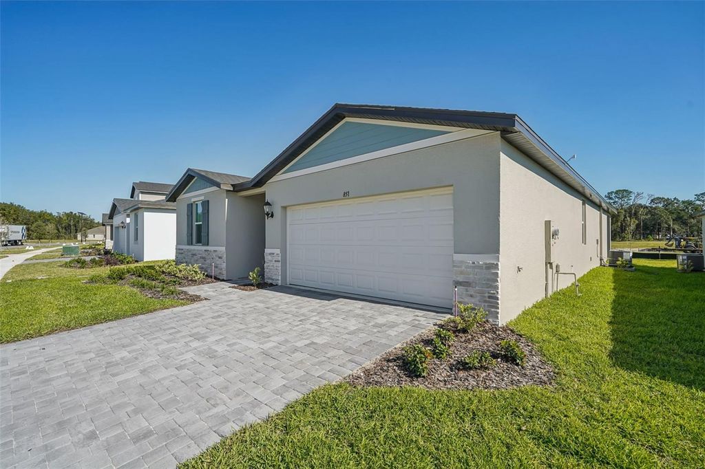 Photo of 851 Sunshower Drive, Haines City, FL 33844 (MLS # O6348090)