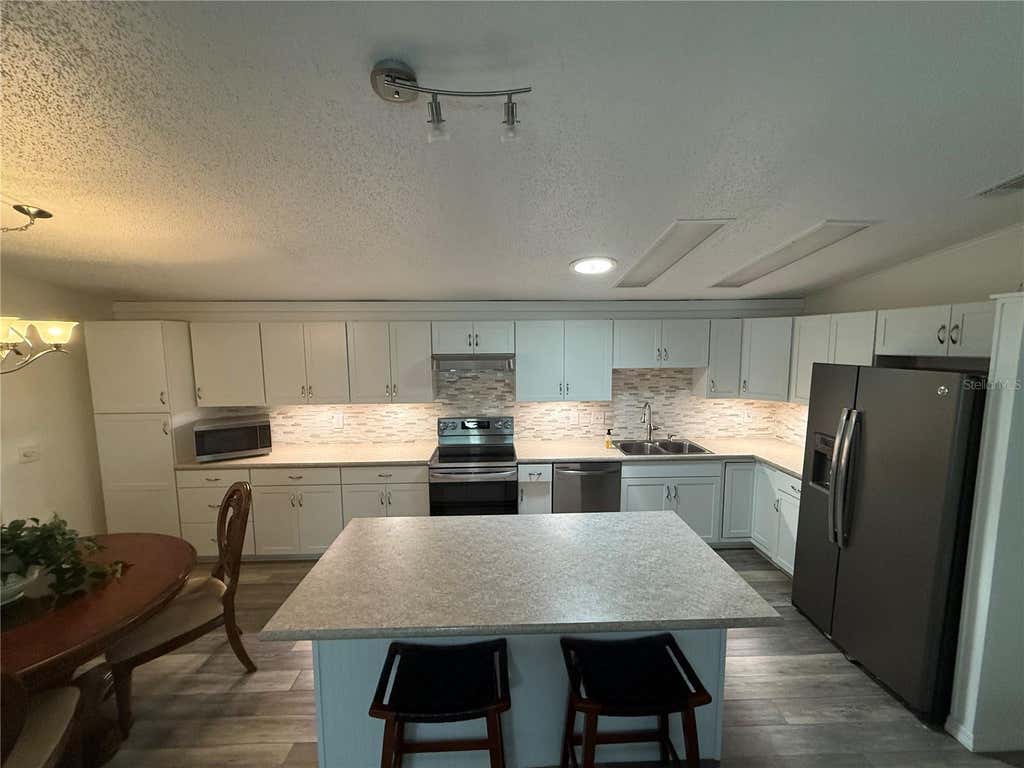 Photo of 802 Oak Boulevard, Wildwood, FL 34785 (MLS # G5116950)