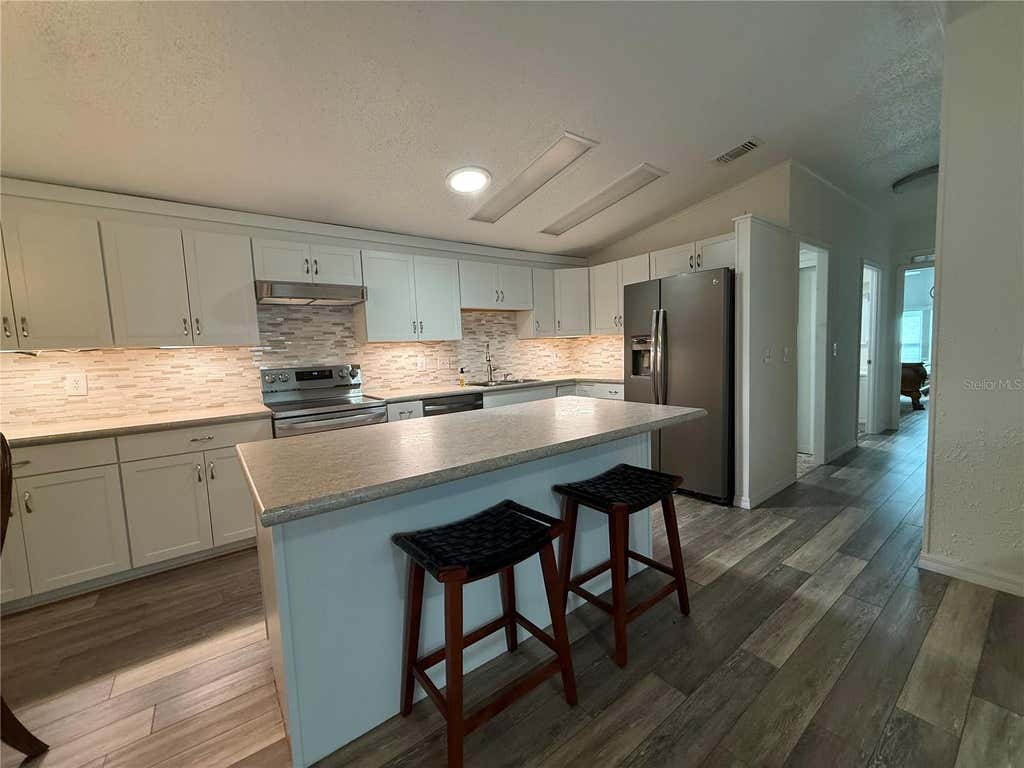 Photo of 802 Oak Boulevard, Wildwood, FL 34785 (MLS # G5116950)
