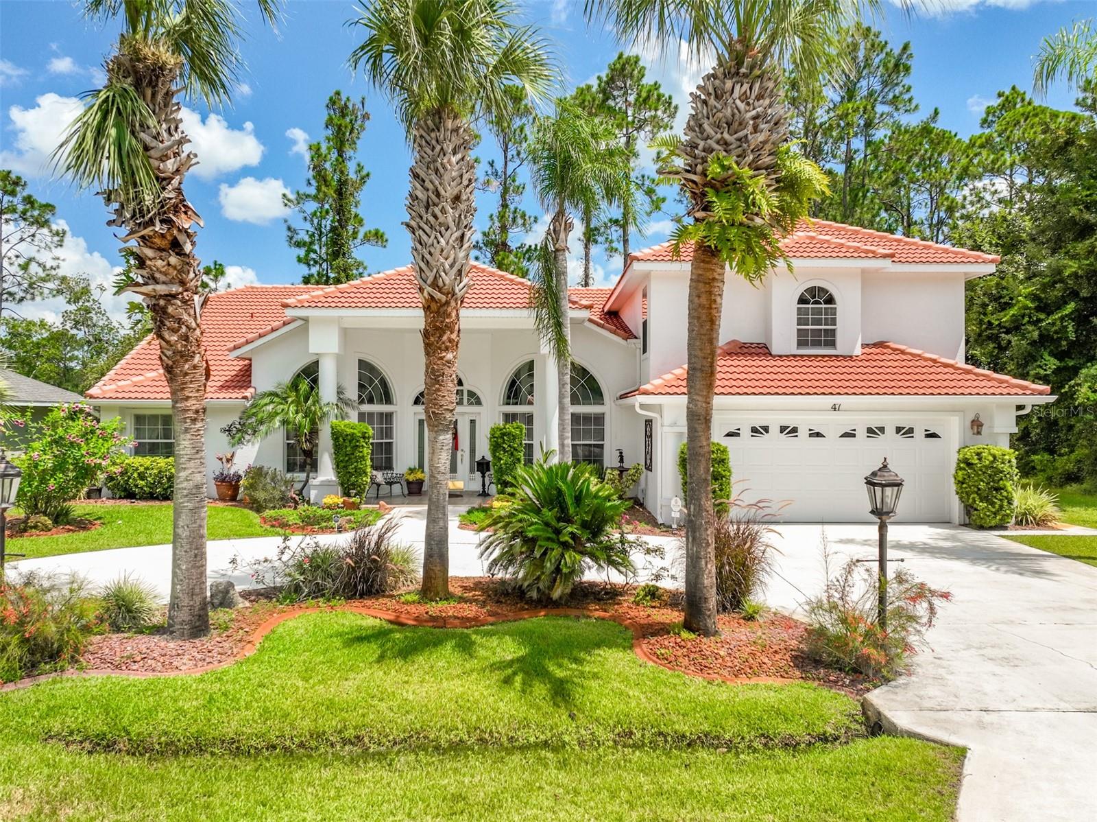 Welcome to this beautifully upgraded custom Fred Beck home featuring 4 spacious bedrooms, 4 full bathrooms, and an inviting in-ground pool and spa with serene lakefront views. Enjoy the expansive layout with cathedral ceilings, elegant plant shelves, and an open, split-bedroom floor plan that’s both bright and functional. The formal living and dining rooms are perfect for entertaining, while the large upstairs bonus room with a full bath offers endless possibilities—ideal for a media room, guest suite, or home office. The primary suite is a true retreat with a 9x9 sitting area—perfect for a home office or reading nook. The en-suite bath boasts double vanities, a jetted garden tub, walk-in shower, and a private toilet room. Step outside to your personal paradise! The covered lanai includes a summer kitchen area, ideal for year-round entertaining. Surrounded by lush landscaping, the home offers exceptional curb appeal with a circle driveway providing ample parking. Don’t miss this opportunity to own a lakefront pool home filled with custom upgrades and timeless charm. Call today to schedule your private showing!
