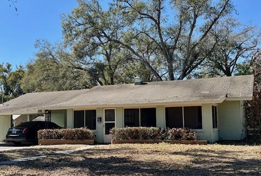 Professional pictures coming soon! Opportunity awaits with this charming fixer-upper situated on a spacious double lot within walking distance to downtown Mt Dora. Whether you're looking to renovate or expand, this property offers incredible potential. Plenty of room for parking your RV/camper/boat in back yard and NO HOA to deal with!!! The existing home offers 2 bedrooms and two bathrooms (one located in the carport area) and a compact footprint ready for renovations. Nice size kitchen that overlooks the spacious back yard and offers eating space. The three car carport at the front of the home presents a strong opportunity for conversion into additional living space, increasing square footage tremendously and overall property value. Add that large primary bedroom and bathroom you've always wanted or a large family room easily by just enclosing the large three bay carport already under roof!! Step out back and enjoy a wide open, private backyard with plenty of room for additions, a pool, detached garage, IN LAW Quarters and much more. Walk to Lake Dora, restaurants, breweries, shopping and nearby Grantham Point park where there is a public boat ramp. Located minutes from the new 429 Expressway which allows easy access to Orlando or anywhere else in Central Florida. Ideal for investors seeking properties in charming and growing Mt Dora!! Property Sold AS IS. House will not pass a 4 point inspection.