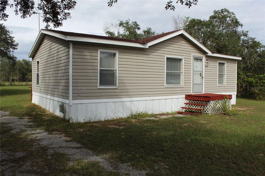 This is a 3-bedroom, 2-bath home in Lake Wales, FL, offers a quiet country lifestyle on a half an acre that is gated and fully fenced, secured back yard for boats, camper and toys. Covered back porch with ramp provides plenty of shade and room for grilling plus there is a utility shed with electric. Large back yard for play work or garden. No HOA gives you more freedom. The move-in ready property is over 850 sq. ft. county water, complete chain link fence with large entrance gate. The property is located in the Lake Pierce area of Polk County and is described as being a great value.