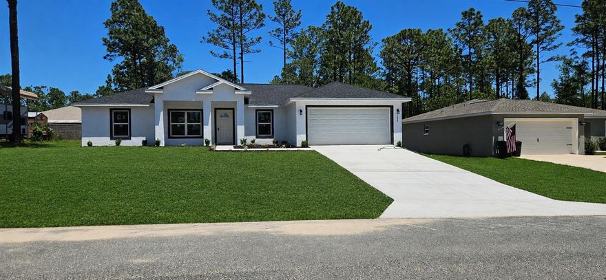 One or more photo(s) has been virtually staged. NEW CONSTRUCTION. This USDA-eligible, stunning new construction features 3 bedrooms, 2 full baths, and a 2-car garage with an automatic opener, complemented by an open floor plan. The home boasts luxury vinyl plank flooring throughout, including the bedrooms, quartz countertops in the bathrooms and kitchen, wood kitchen cabinets with soft-close doors and drawers, and a large kitchen island with bar seating. It comes equipped with stainless steel appliances such as a range, dishwasher, microwave, and fridge, along with washer and dryer and recessed lighting throughout. Additional highlights include an indoor laundry room with washer and dryer included, beautifully tiled bathrooms with glass shower door in the master bath, and a covered lanai with a fan and recessed lighting. **2-10 HOME BUYER STRUCTURAL WARRANTY PROVIDED BY BUILDER**