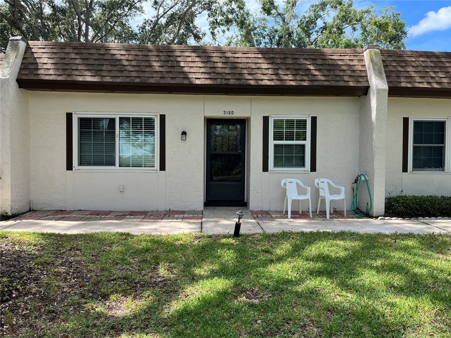 AMENITIES GALORE! 55 + Community. Don’t miss this 2 bedroom, 2 bath condo in the desirable area of Highland Lakes. Open floor plan with living/dining combo, enclosed Florida room. All new interior paint, new vinyl flooring throughout, wood cabinets in kitchen, dishwasher, side by side refrigerator, microwave, flattop stove, stackable washer and dryer.  Large master bedroom with new ceiling fan, blinds at windows, two sets of closets, master bath with walk in shower, guest bathroom with both tub and shower. Covered carport and outside storage closet. Highland Lakes is the premier golf and social community of Palm Harbor. Three executive golf courses, along with social events, clubs and a full library. Sports such as tennis, bocce, pickleball, shuffleboard, heated pools. Whatever your interest, there are so many clubs and events to choose from such as arts and crafts, dancing, and so much more. If you enjoy swimming or sitting by the pool, you can meet new friends, play cards or just relax and read a book. You can take a pontoon boat tour on Lake Tarpon which departs and returns to the dock at the Lodge on Lake Tarpon. Monthly rent includes, lawn care, basic cable, internet, water, sewer, trash collection and ground maintenance. Close to Florida’s beautiful beaches, shopping, theaters, restaurants, sporting events, medical services, Tampa and Clearwater airports. NO PETS! To learn more about Highland Lakes, please go to https://highlandlakeshoa.org/. Annual, unfurnished rental.