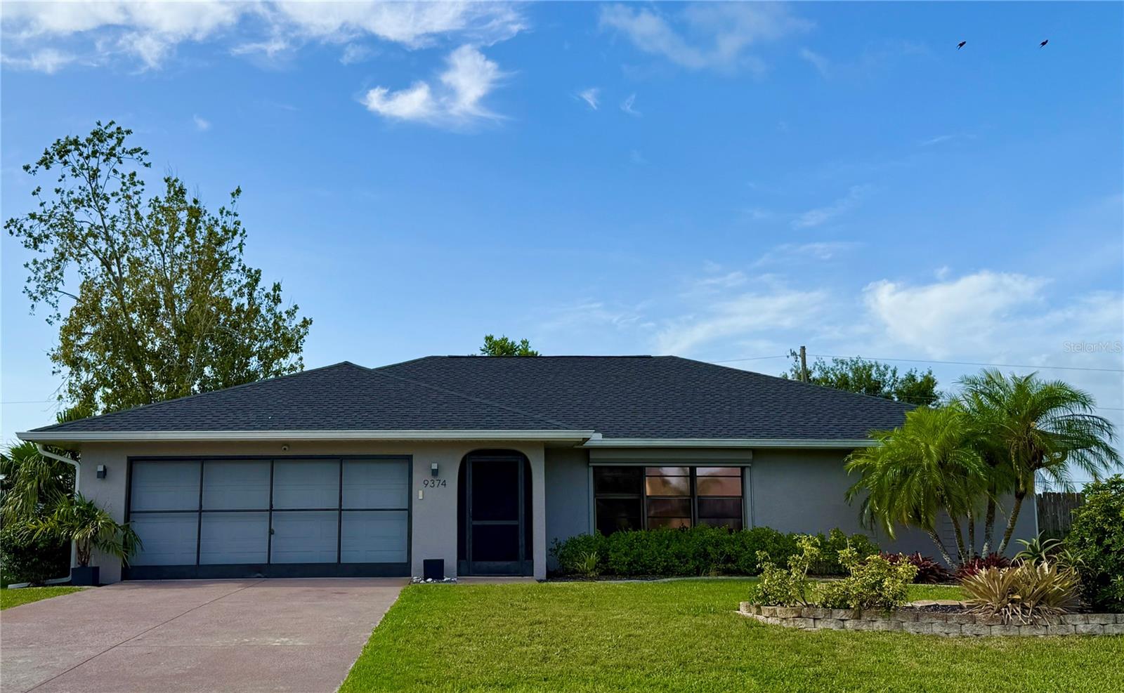 This home has a split-bedroom layout with vaulted ceilings and ceiling fans in every room. Recent updates include a new roof, soffit, and gutters completed in 2023, along with a new water heater the same year and a new dishwasher installed in 2025. The kitchen has two pantries. There are two linen closets and 2 of the bedrooms have walk-in closets. There are roll-down hurricane shutters for storm protection.
The garage has a pull-down attic for extra storage and a built-in workbench. Outside, a 17-by-12-foot paver patio outdoor shower and fire pit. The storage shed is 10 x 12. There is also electrical in place for a second structure in the backyard. A 30-amp RV hookup is located near the driveway.
Located about half a mile from both elementary and middle schools, the property also benefits from a recently added sidewalk along the street, making daily walks or bike rides more accessible. Exterior lighting has been updated to improve visibility and security after dark. No HOA, no CDD, no Flood insurance.