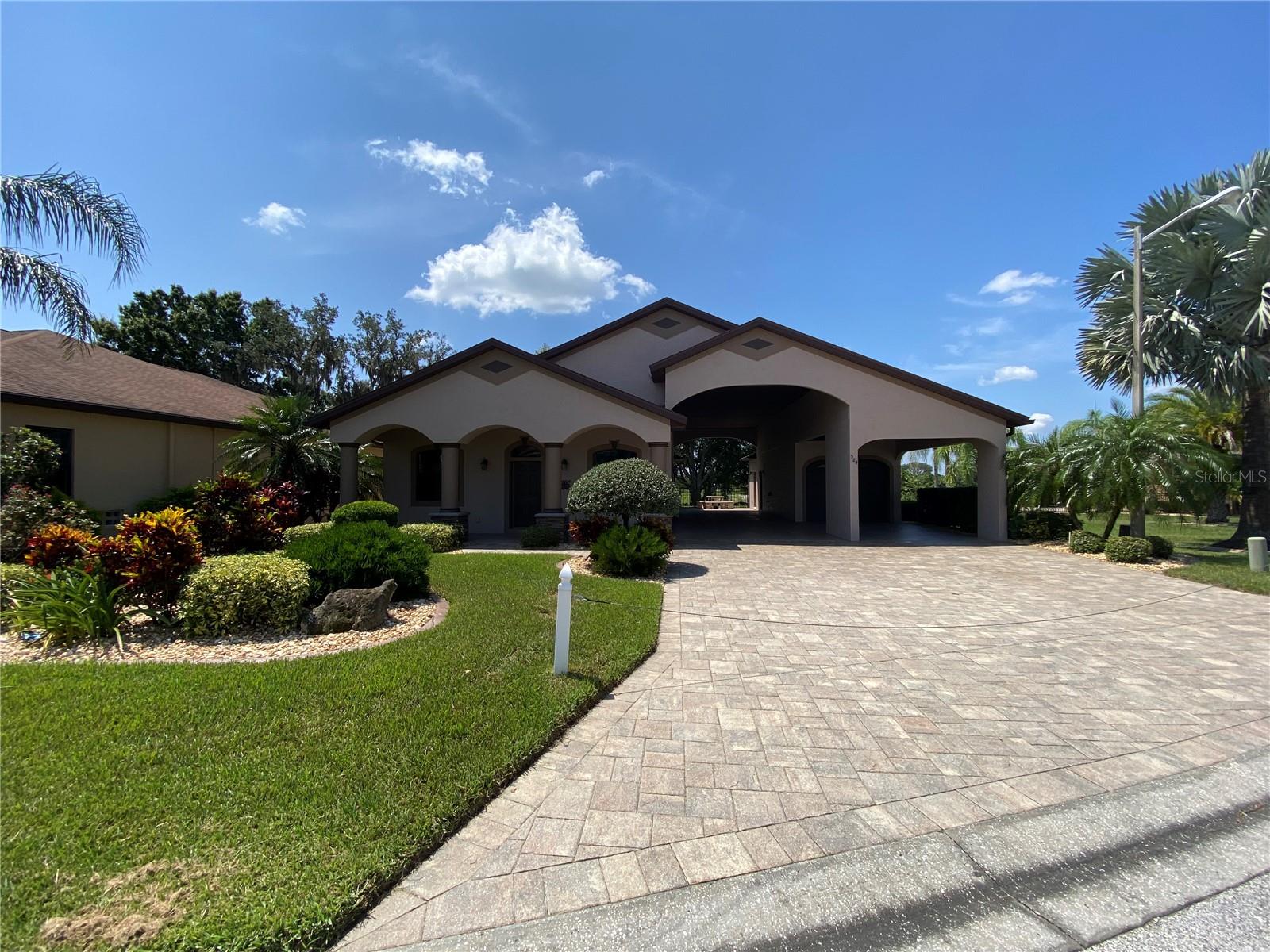 This home is a 2 bed/2 bath in the sought after community of Mt. Olive Shores North. A 55+ RV Community. This home was built in 2014 and has everything you would need to spend your winters or all year round. An open floor plan for the kitchen and living area is perfect for entertaining. The primary bedroom is located off of the living area with access to the extended living area in back of the house. This area is another great spot for entertaining with a beautiful view of the backyard. The primary bathroom includes a walk-in tub as well as a shower for convenience. The Rv port is approximately 55x16. In addition to the garage is a carport for coverage of a second vehicle. The home was repainted in 2022 and has a beautiful front porch for relaxing in the evenings. The floors in the RV Port and the garage have been upgraded to include an epoxy coating for durability. The garage has its own mini-split for comfort during the summer months. The washer and dryer are included in the purchase and most TV's as well. Call for an appointment to see this beautiful home.