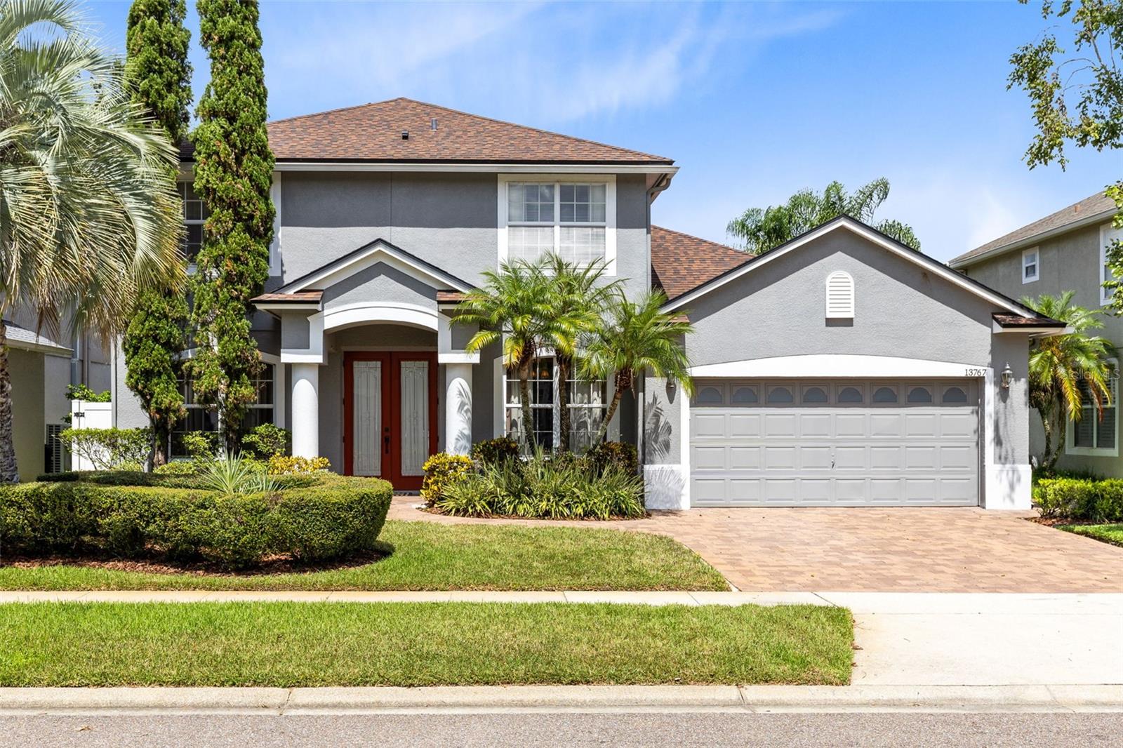 WELCOME HOME! This gorgeous POOL home with POND VIEW has EVERYTHING you need! This home has been meticulously maintained by only two families throughout its life. You'll find the perfect blend of updated and a homey feel along with custom features. As you walk inside, you'll notice a large dining room and a formal living room (which is currently being used as a home office) and the beautiful TRAVERTINE TILE FLOORING throughout the entire lower level. From CUSTOM STONE WORK to the CUSTOM KITCHEN CABINETS AND PANTRY, you'll be amazed. There are even CUSTOM DOORS leading to the under the stairs storage. The NEWER STAINLESS APPLIANCES, all less than 4 years old, and the UNDER CABINET LIGHTING and vent hood are a focal point. The kitchen overlooks the ample size dinette and family room with large sliding doors leading out to the lanai and pool. You'll find one LARGE BEDROOM DOWNSTAIRS with a walk-in closet and a FULL BATHROOM that includes a WALK-IN SHOWER which is perfect for an older adult or your guests. Your pool area and COVERED LANAI are perfect for entertaining or just relaxing while enjoying the POND VIEW at the end of the day. Also, 2 ROLL OUT AWNINGS provide additional shade for friends and family. The pool deck has just been repainted and the pavers provide easy access around each side of the house. Upstairs you'll find HUGE bedrooms each with CUSTOM CLOSETS. The PRIMARY SUITE IS 22 FEET LONG and offers a large walk-in closet, two SEPARATED SINKS, one with a VANITY, a private water closet, a walk-in shower and a large SOAKING TUB. BRAND NEW CARPET installed throughout the upstairs and on the stairs at the end of August 2025. Beautiful BRICK PAVERS installed in 2023, vinyl fenced back yard in 2023, FRENCH DRAINS along each side of the house in 2023, exterior paint in 2022, interior paint 2025, roof 2019, pool motor 2019, AC is a 5 ton, 16 SEER in 2016 and pool screens replaced 2025. Waterford Lakes Town Center is 2 miles away with lots of shopping and restaurants. Easy access to highway 408 and 417. Cocoa Beach 45 miles away and Disney 45 minutes away.