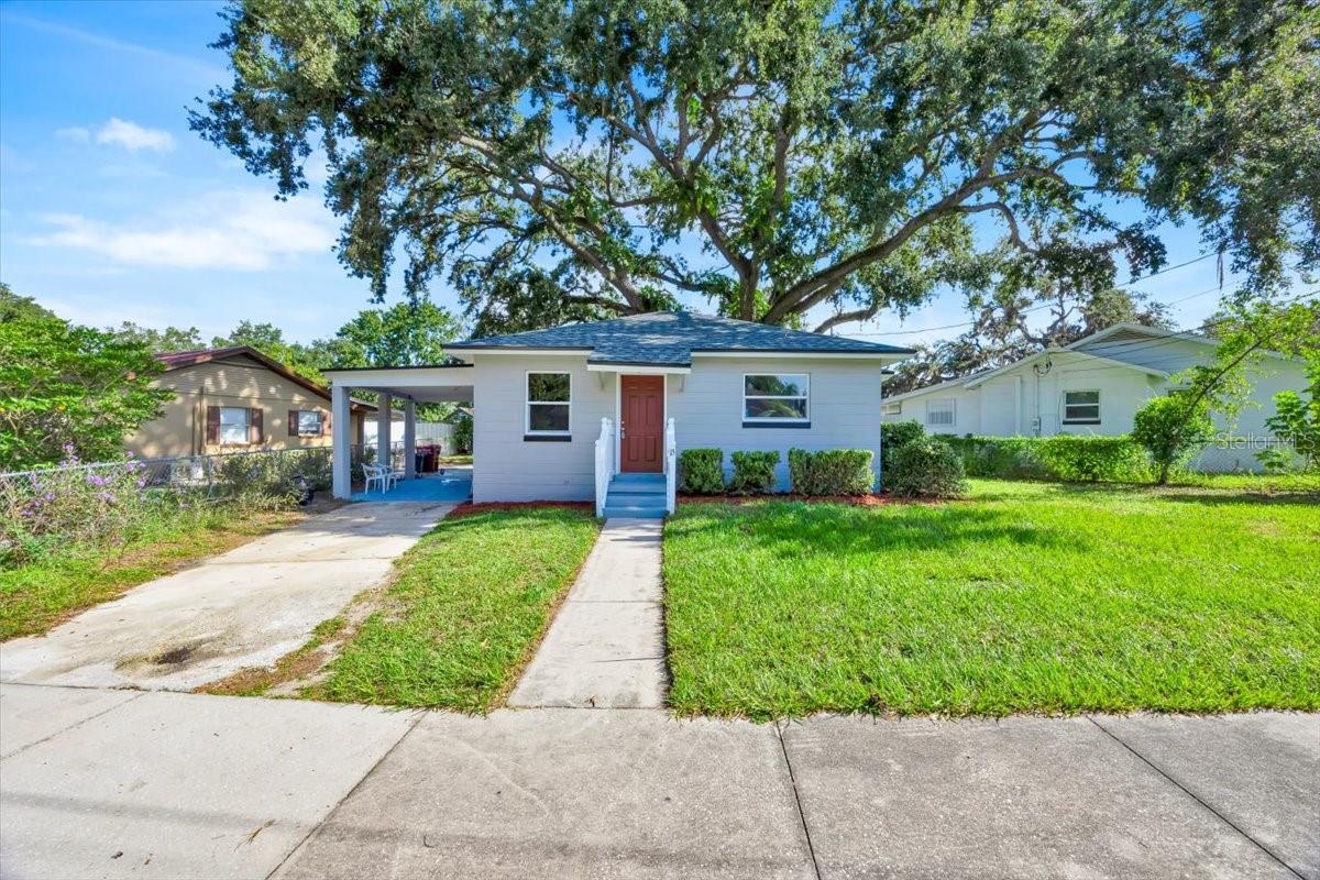 Fully renovated two-bedroom, one-bath concrete block home located in the heart of Plant City. This move-in-ready property features a new roof, stainless steel kitchen appliances, fresh interior and exterior paint, and luxury vinyl flooring throughout. The AC system and ductwork are only two years old. Enjoy new interior and exterior doors, windows, updated wiring, supply and drain plumbing, and all-new lighting. The kitchen and bathroom include white shaker cabinets, granite countertops, and stainless plumbing fixtures. The home also offers a large covered rear porch, a carport, a fenced rear yard, and no HOA. Not located in a flood zone. FHA, VA, and conventional loans accepted.
