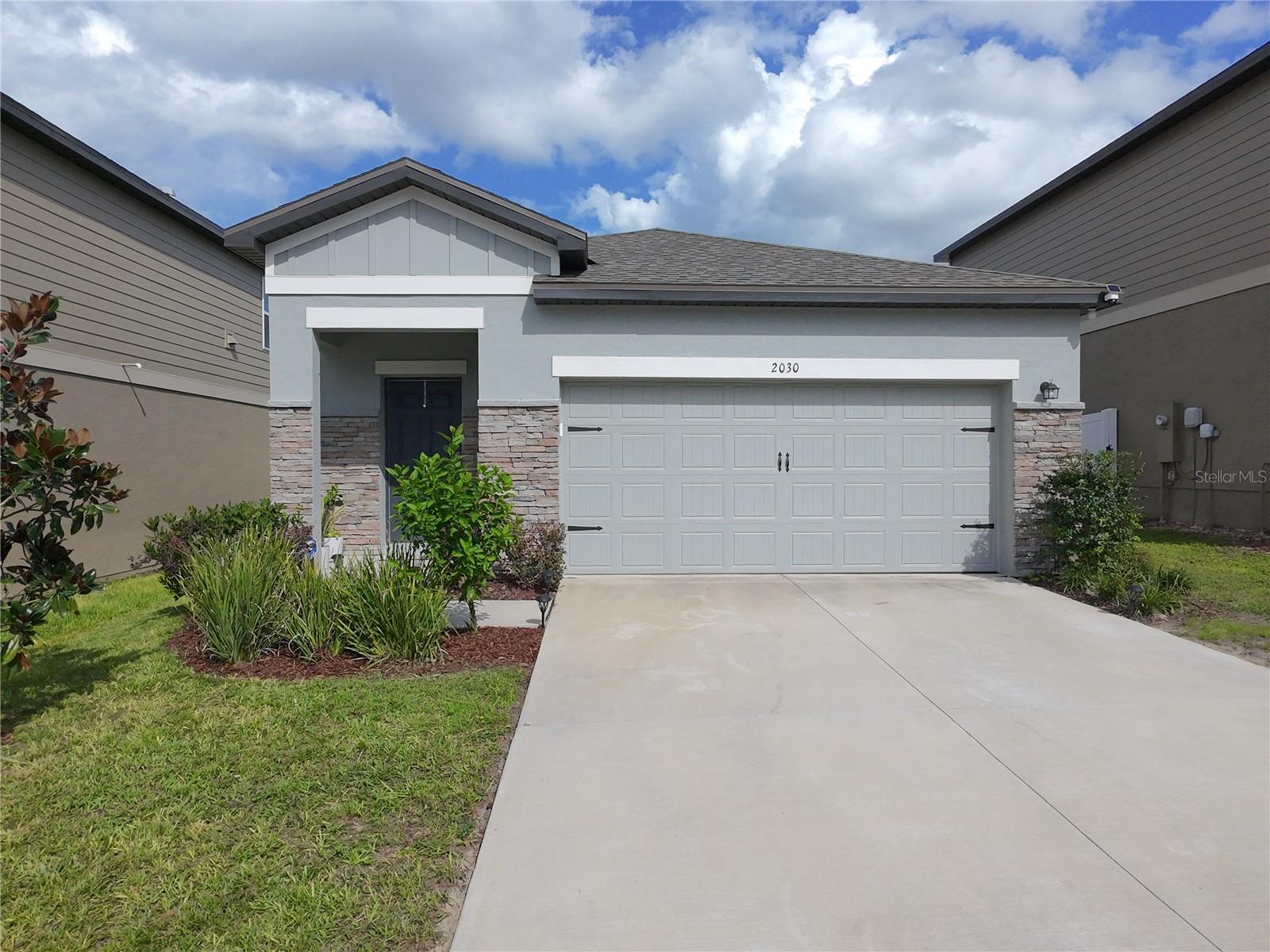 Discover this newly built 3-bedroom, 2-bathroom home at 2030 Hemingway Cir in Groveland, FL. Thoughtfully designed living space, this residence offers a comfortable and functional layout perfect for families or professionals. The open-concept living area flows seamlessly into a well-appointed kitchen, ideal for both daily living and entertaining. Tile flooring throughout all main living areas including living and dining areas, and lots of natural light that flows thru creating an inviting and cozy space. The master suite provides a private retreat with an en-suite bathroom. Additional features include a two-car garage and a manageable fenced-in yard for low-maintenance living. Enjoy the benefits of a low HOA and no CDD fees while living in a neighborhood with convenient access to schools, parks, main highways like, Hwy 27 and route 50. Whether you’re a first-time homebuyer or seeking a modern, move-in-ready retreat, this home combines comfort, convenience, and affordability.