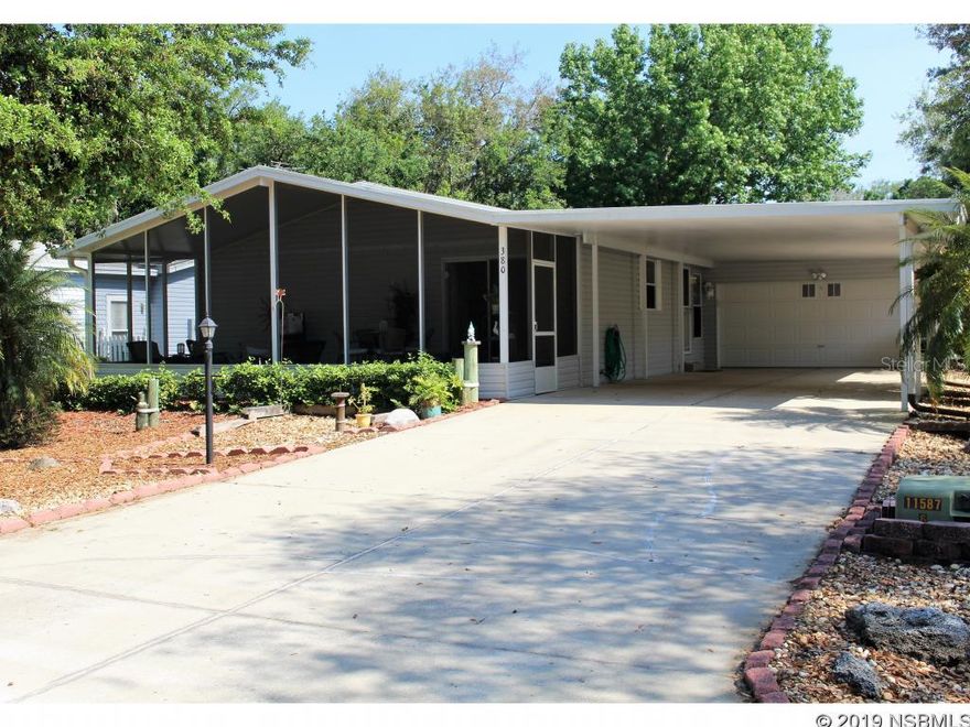 This gorgeous 2 bedroom, 2 bath home is nestled on a beautiful landscaped lot and is situated directly across from one of the greenbelt areas. The kitchen has been updated with hickory cabinets, quartz countertops and newer appliances. Many other features include vaulted ceilings, laminate and tile flooring throughout, extra closet shelving,  large screened patio, new hot water heater, new window treatments and more. Parking is no problem with the double carport and garage. Lighthouse Cove is a beautiful riverside gated community located on the Intracoastal Waterway, not a rental community, own your own property! Lighthouse Cove features a large heated swimming pool, club house, tennis/pickleball courts, shuffle board courts, river access, boat ramp for shallow water boats, recreational picnic area on river, and boat/RV storage. Lighthouse Cove has weekly events at the club house. Golf carts are a second means of transportation. It is a boating/fishing paradise being located a short distance from the world famous Mosquito Lagoon. Get lost in the local backwaters (Canaveral Seashore/Merritt Island Wildlife Refuge) in your kayak or boat. Don't miss out. A great opportunity to live in paradise!!! ;Water: City