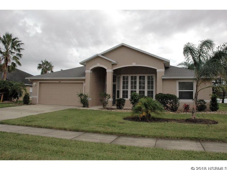 REDUCED, SELLER FINANCING AVAILABLE Beautiful, Lakefront Home, ICIâs Mansfieldâs model retreat is a must see.  This 4 bedroom, 2 bath home is located in the Waterâs Edge Community with great curb appeal.  Step inside the foyer and you will notice gorgeous laminate flooring (Installed in 2013) that leads to the Great Room with sweeping views of the extended screened Lanai & surreal lake! The open floor plan concept for this model, reveals a spacious dining room, bright and airy casual dining area. The chef in your family will enjoy preparing spectacular meals in the newly remodeled open kitchen that features Newer GE Slate Finish Appliances, Newer Glass Tile Back Splash, lots of cabinet & counter space, and a corner sink with a view of the lake. Relax in the Owner's Suite and enjoy the lake view as you wake up every morning. This spacious bedroom has an attached bath with new tile flooring, a double vanity, large soaking tub and separate walk-in shower. Three additional bedrooms, a Guest Bath, plus a Laundry Room completes this Executive Home. All the bedrooms have newer carpeting & both baths and Laundry Room have newer tile floors. If you enjoy the outdoors, you will love the extended screened Lanai with all new screening. Triple pocket sliders in the Great Room leads to this outdoor living space. Some other recent updates to this home include: New Roof 2018, Newer Central A/C in 2013 with additional ducts, Newer Faucets & Toilets, and Lighted Ceiling Fans Throughout! This home is move in ready & conveniently located close to I-95, I-4, many shopping & dining options.  Zoned for the top rated schools, Spruce Creek High School, Creekside Middle School and Cypress Creek Elementary. Approximately 45 minutes to Orlando's attractions and a short ride to the beach makes this home perfect for your family. Come see this one today! All information and measurements deemed to be accurate but cannot be guaranteed. ;Water: City